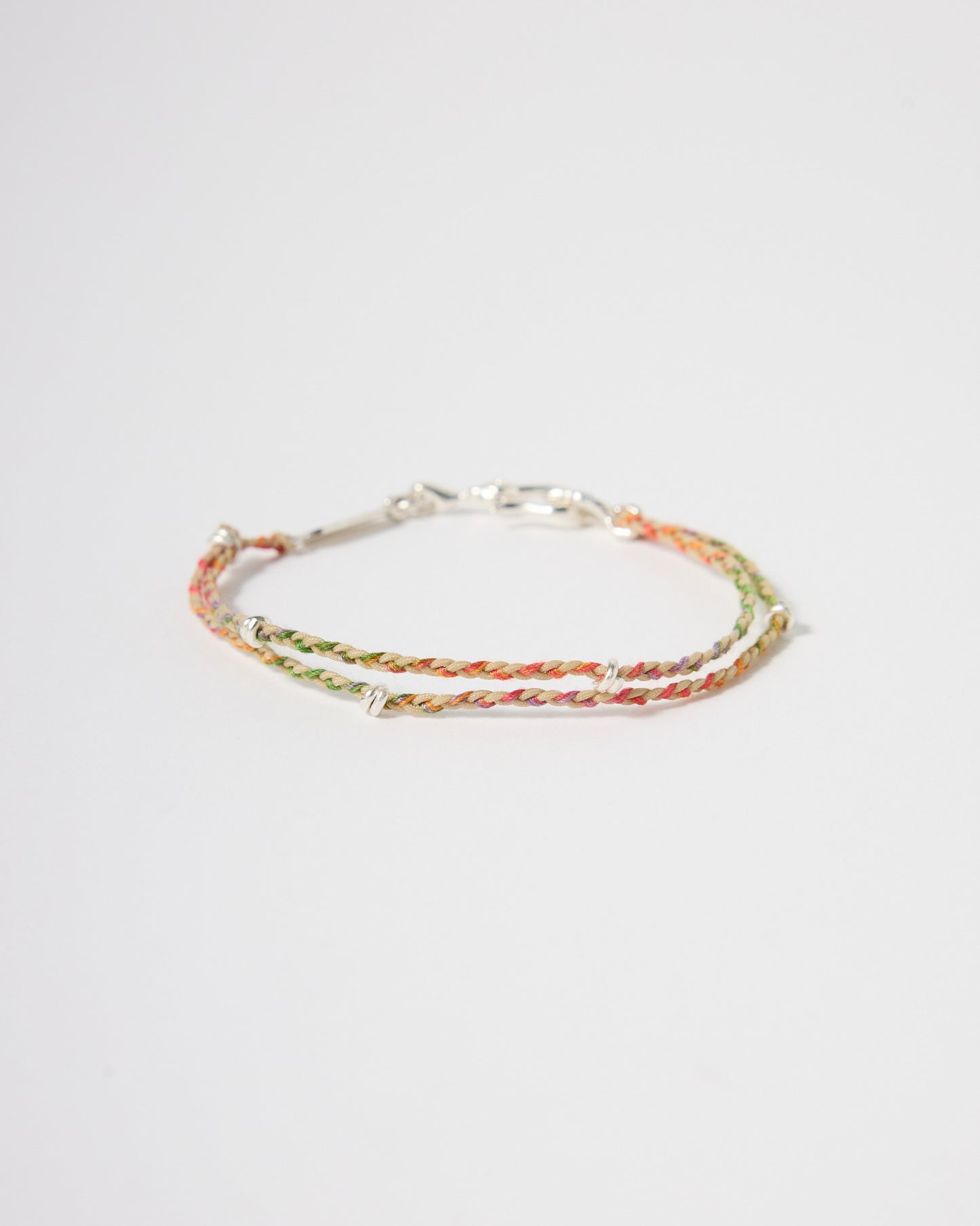 Handwoven multicolor cord bracelet with sterling silver accents, minimalist rainbow bracelet