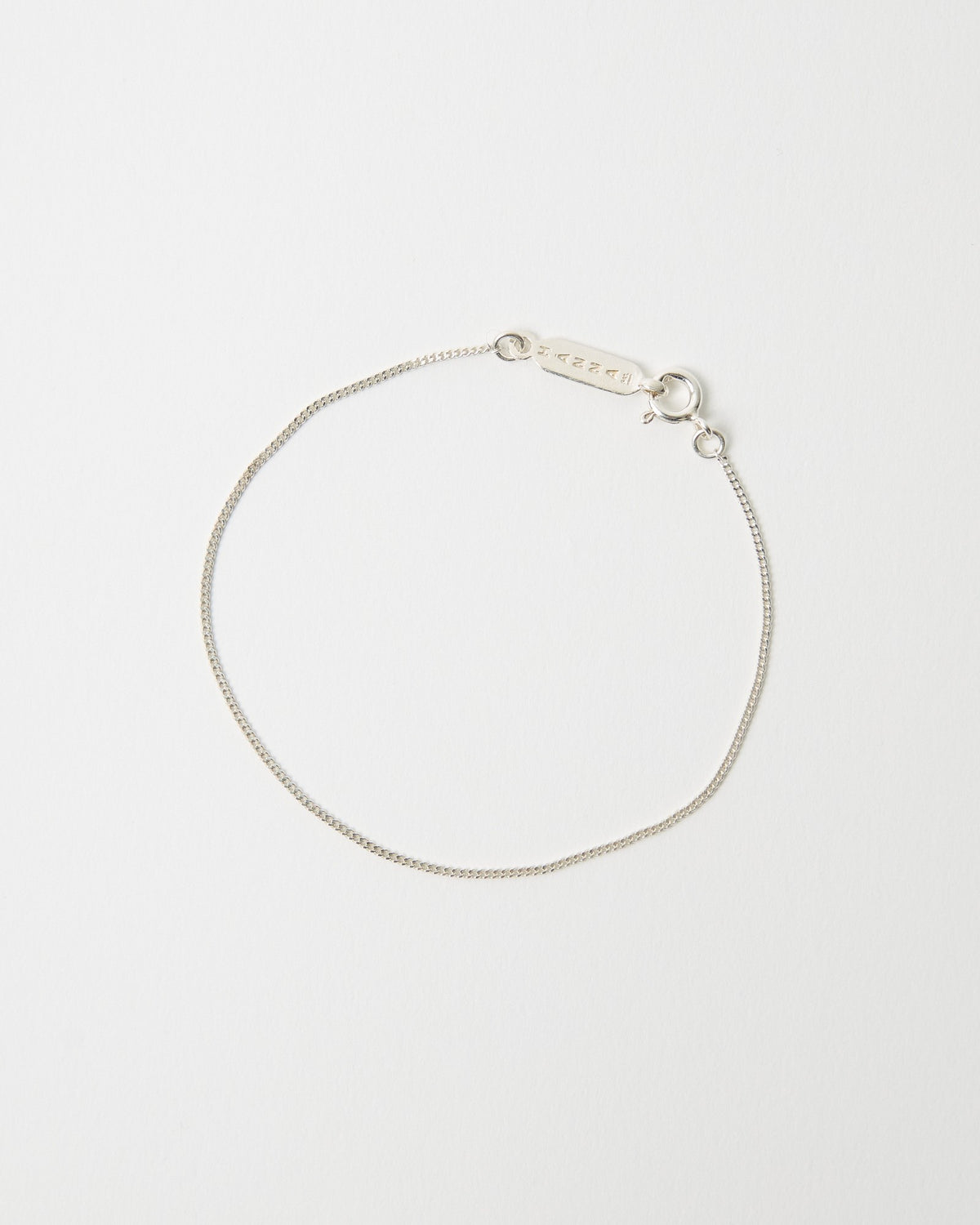 Sterling silver curb chain bracelet with logo tag and clasp – HANNA543 B1045 whisper curb chain