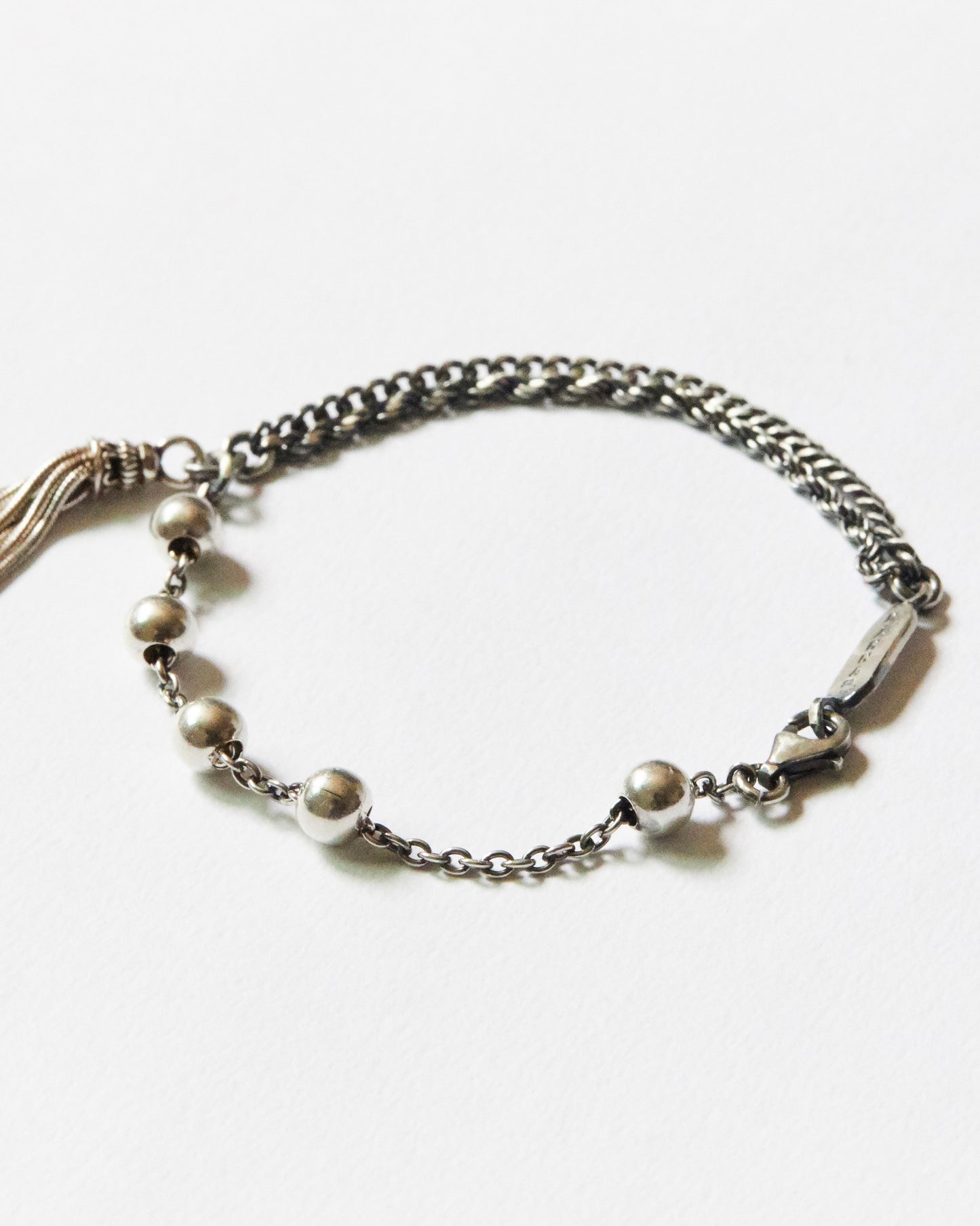 close-up of antique silver bead chain bracelet showing round bead details