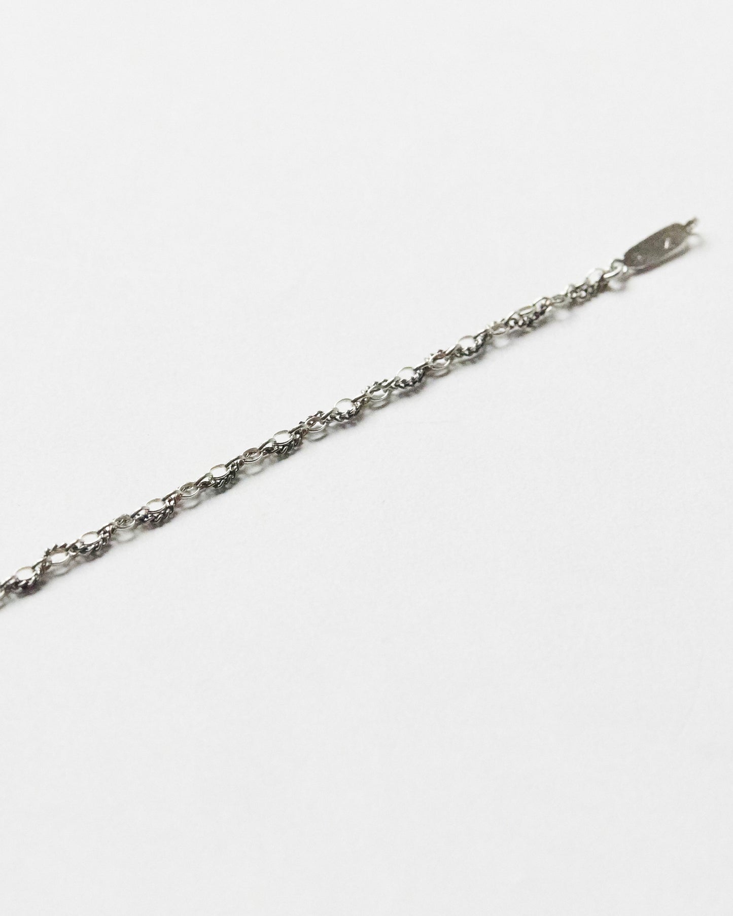 Delicate sterling silver chain bracelet with mixed link texture