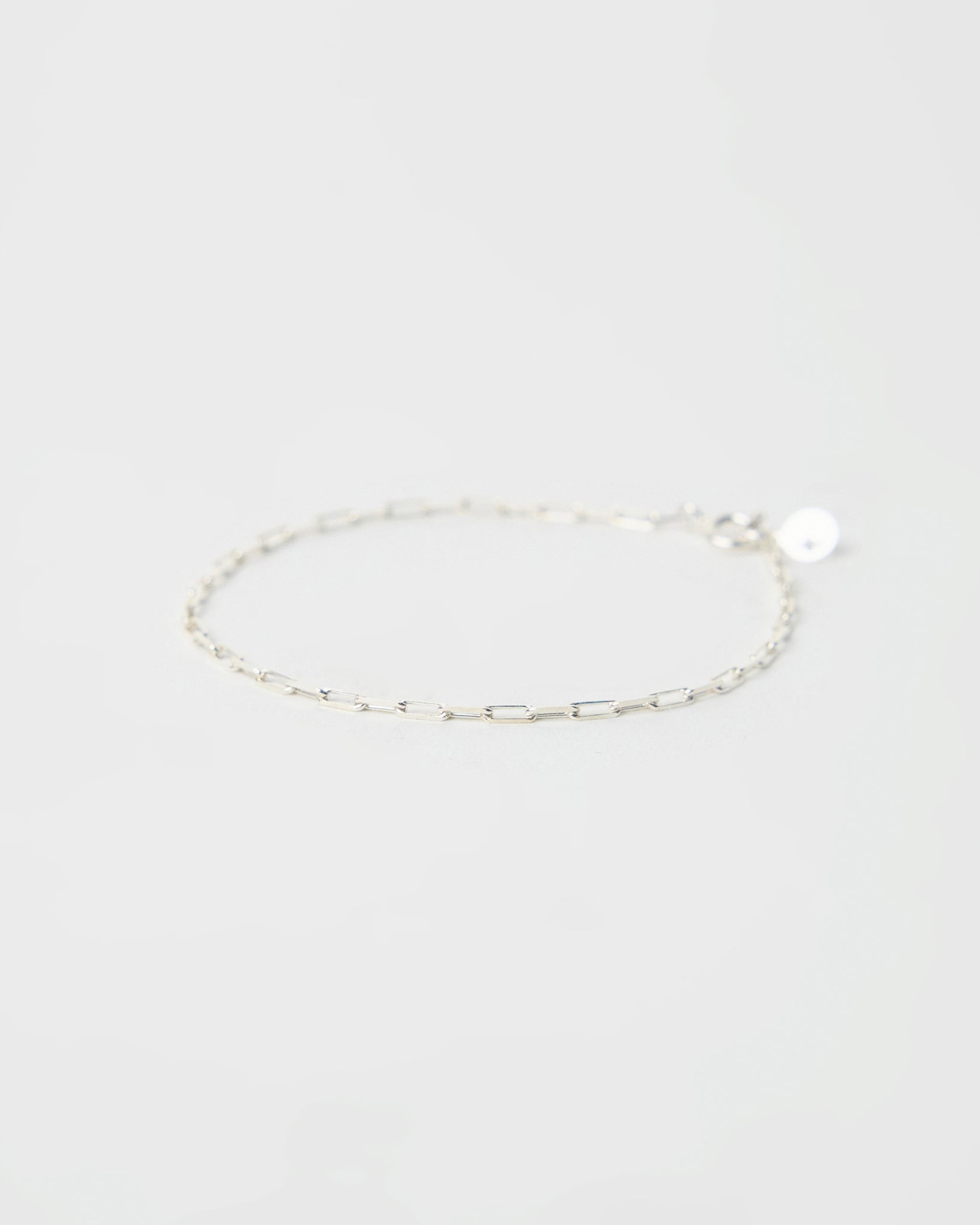 architectural silver chain bracelet composed of elongated rectangular links, clean linear form