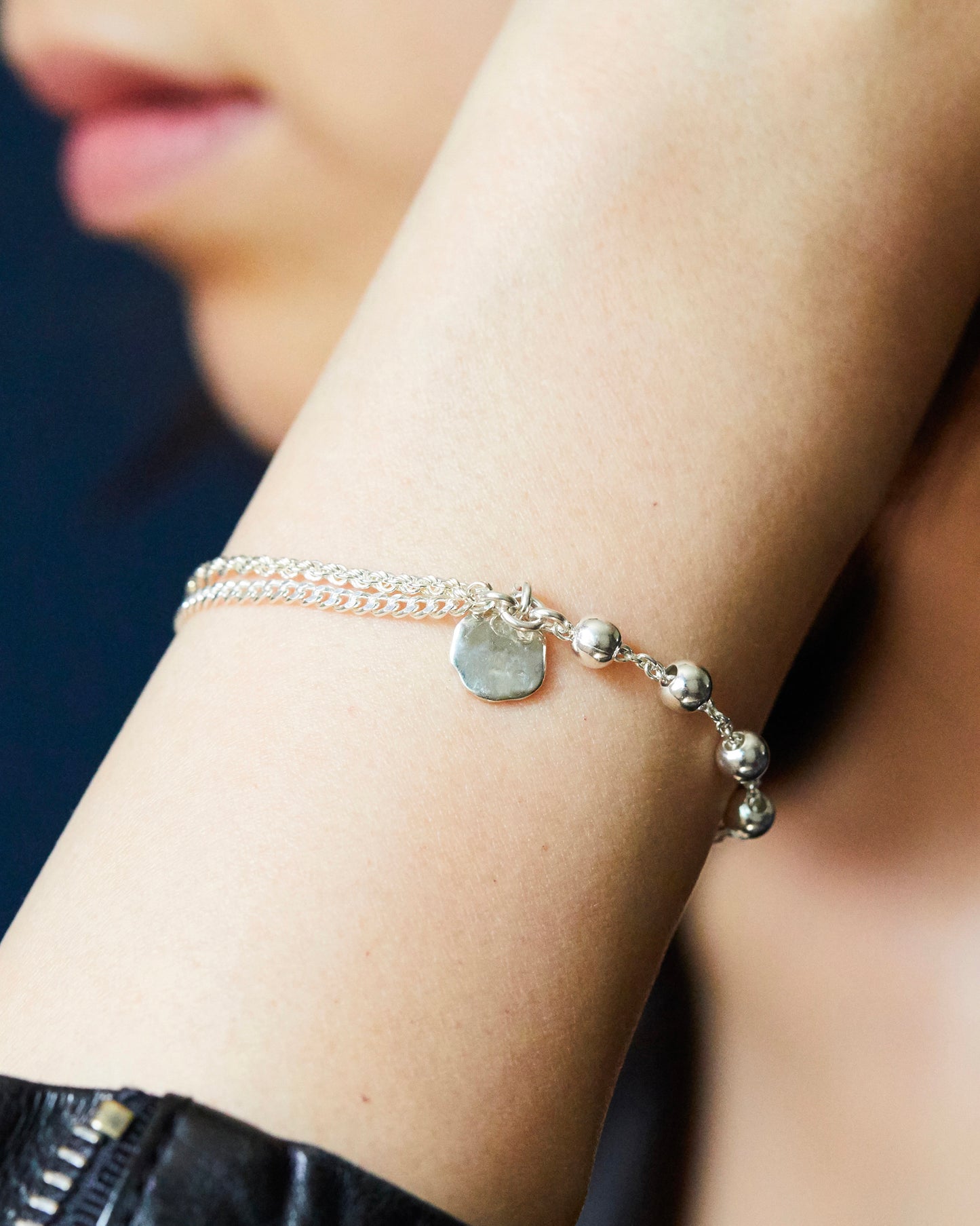 silver bead bracelet worn on wrist casual everyday styling minimal jewelry look
