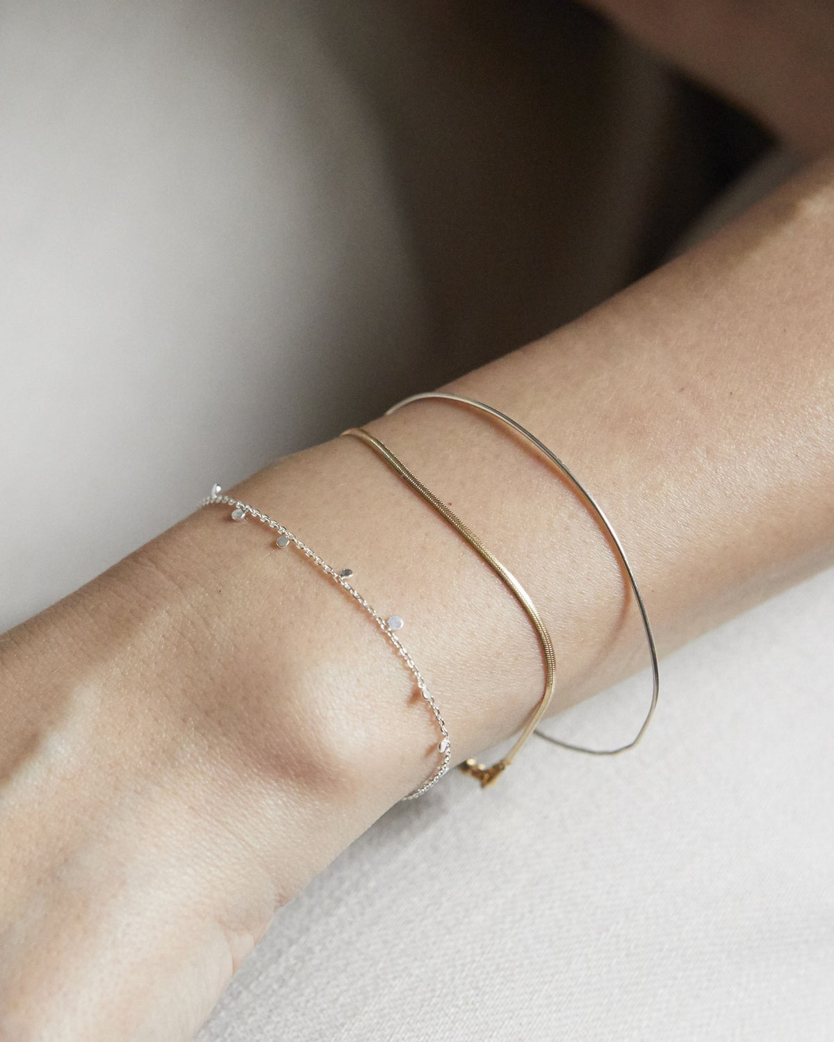 Silver dot chain bracelet stacked with fine silver and gold bangles – HANNA543 B96 dew drop garland