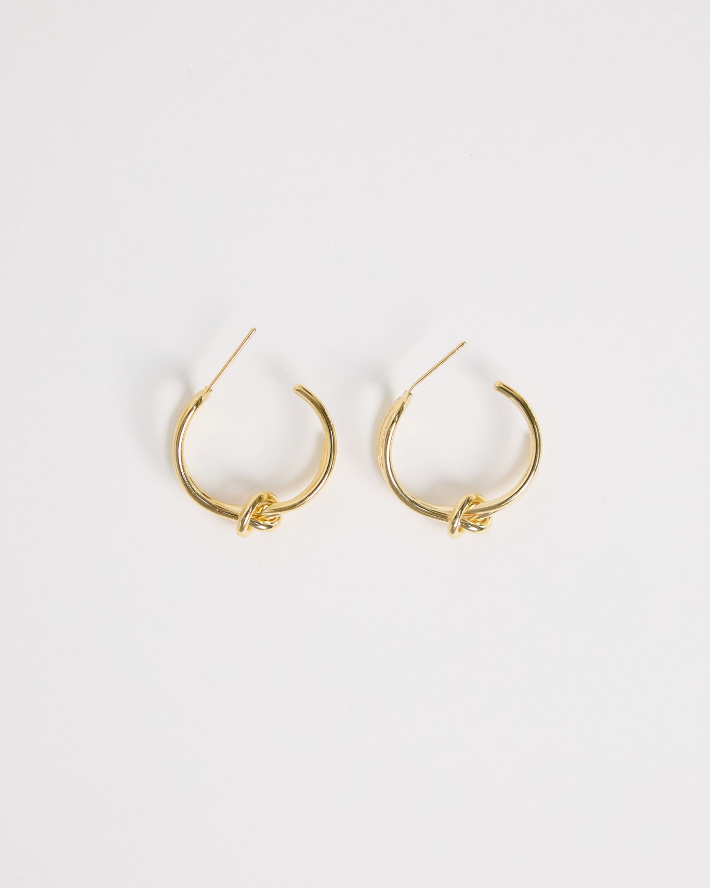 gold knot hoop earrings pair minimal double hoop design clean studio jewelry gold plated everyday earrings