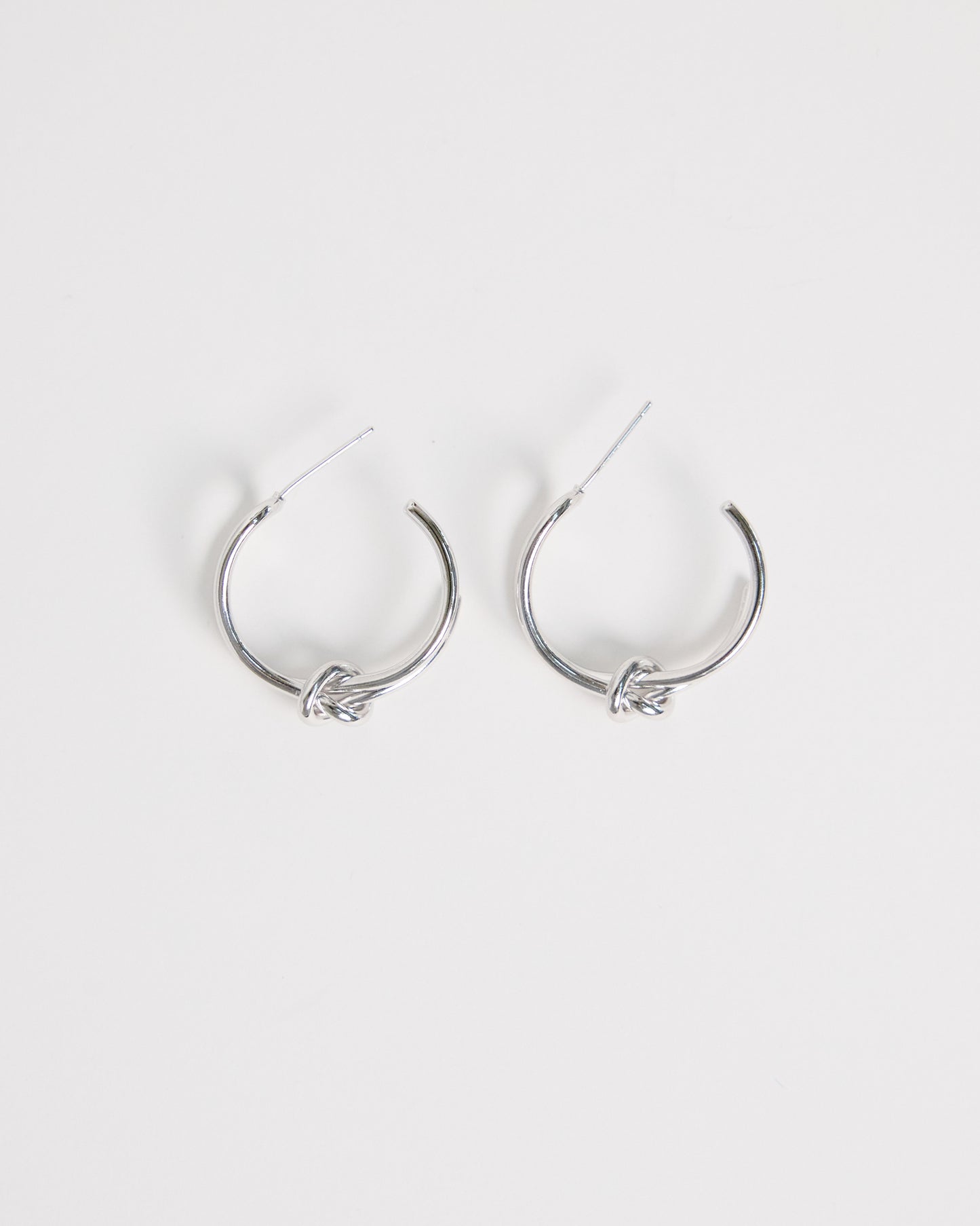 silver knot hoop earrings minimal double hoop design modern clean jewelry everyday silver earrings