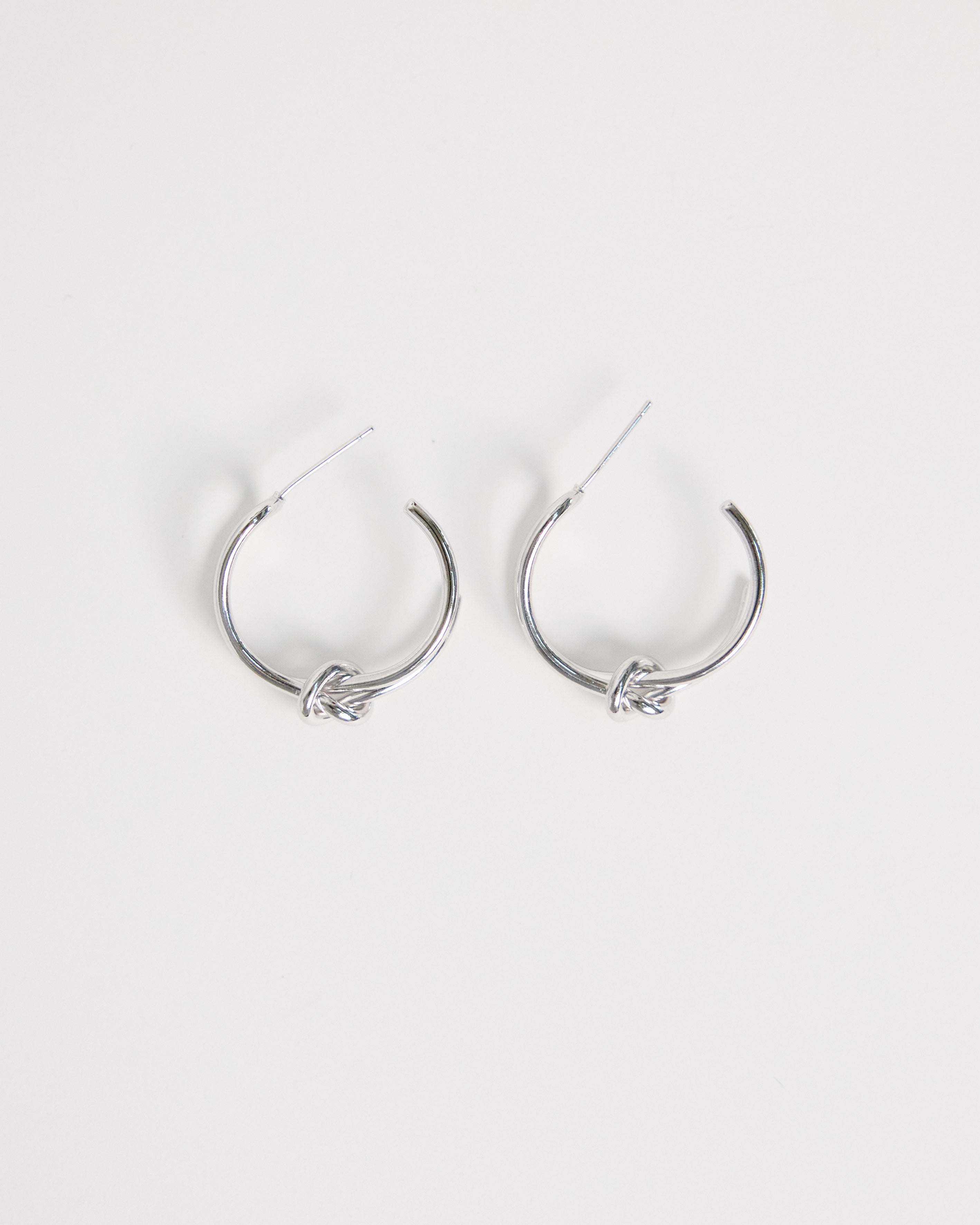 silver knot hoop earrings minimal double hoop design modern clean jewelry everyday silver earrings