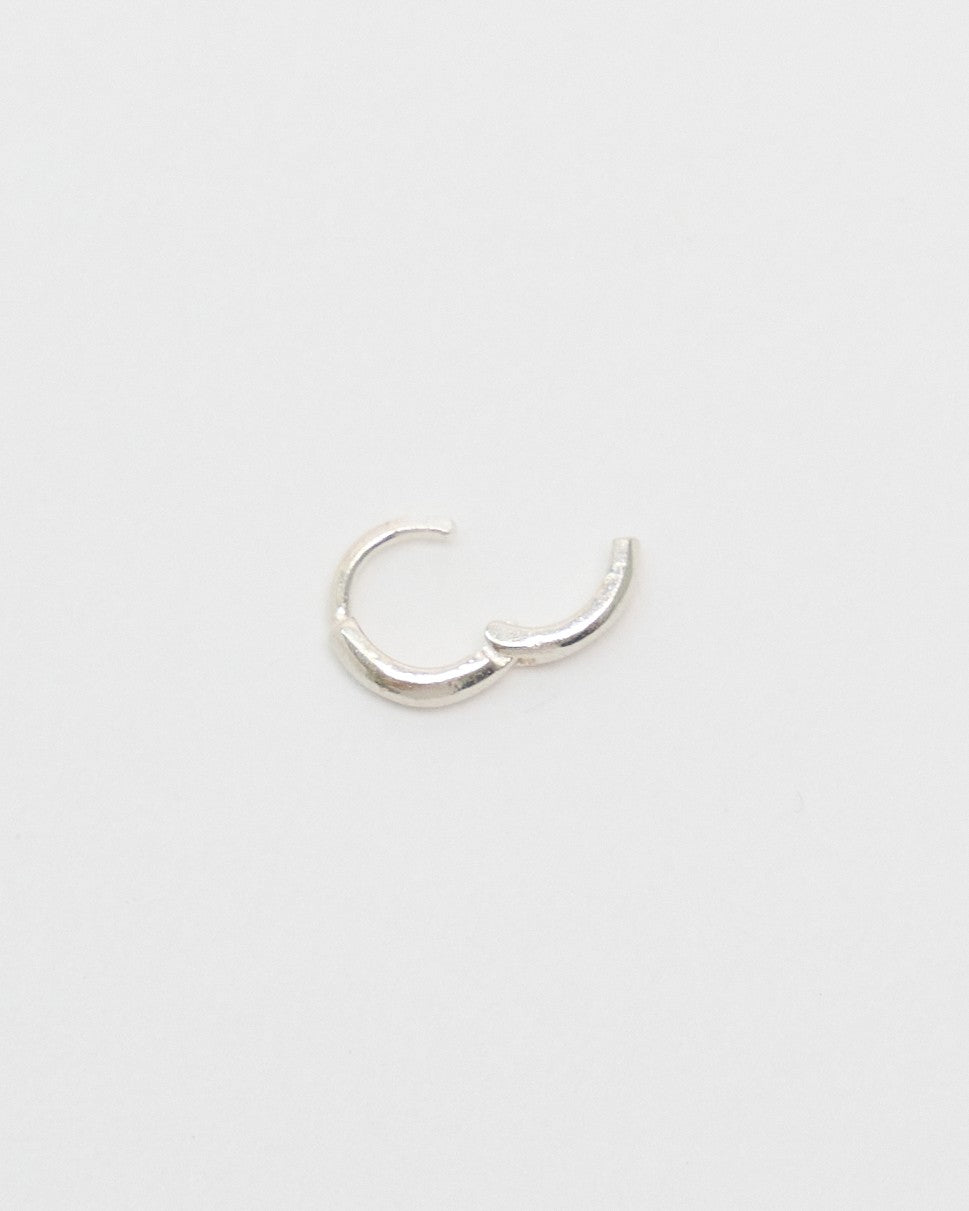 Sterling silver huggie hoop earring with its one-touch hinge open – HANNA543 E155 soft halo huggie