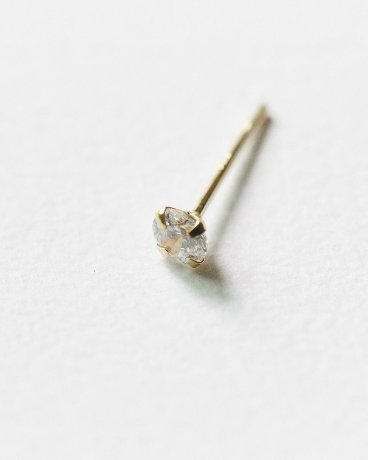 14K solitaire stud – three sizes, from barely-there to a soft glint | HANNA543