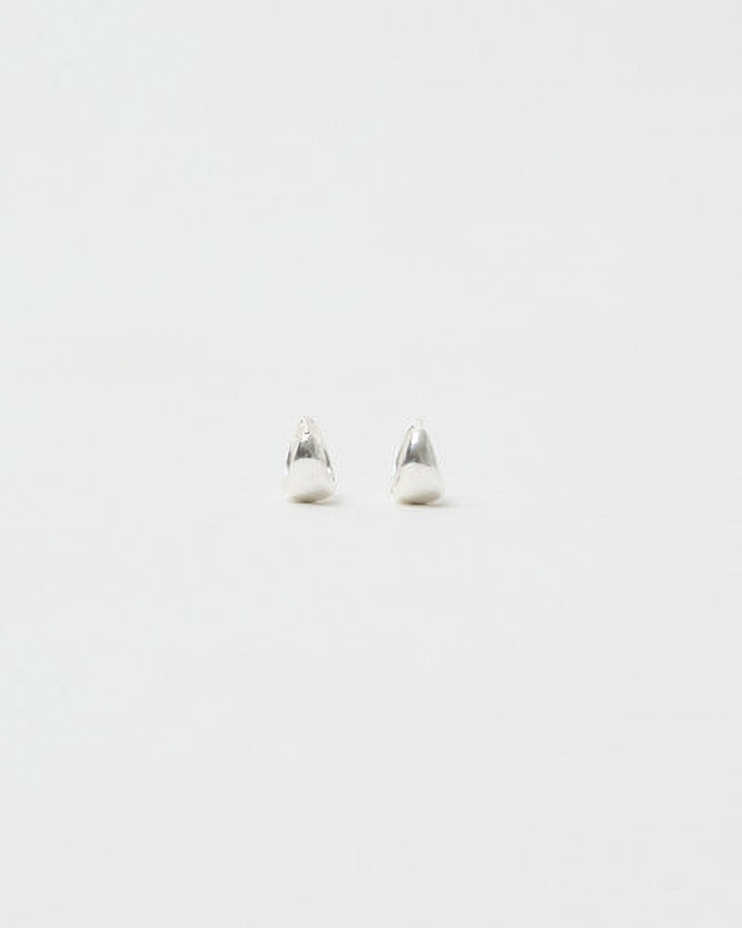 Pair of silver earrings on a white background