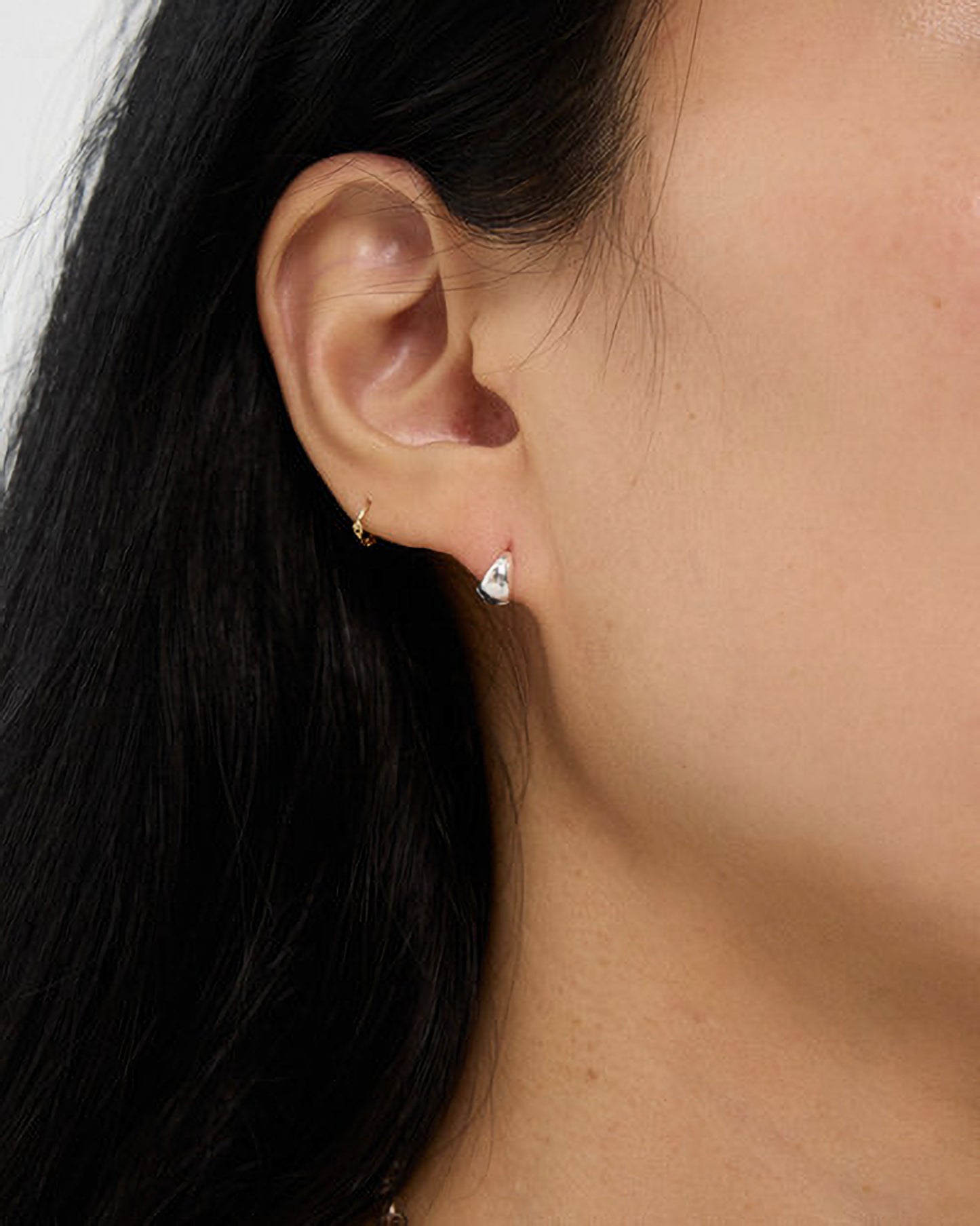 Close-up of an ear with a small earring
