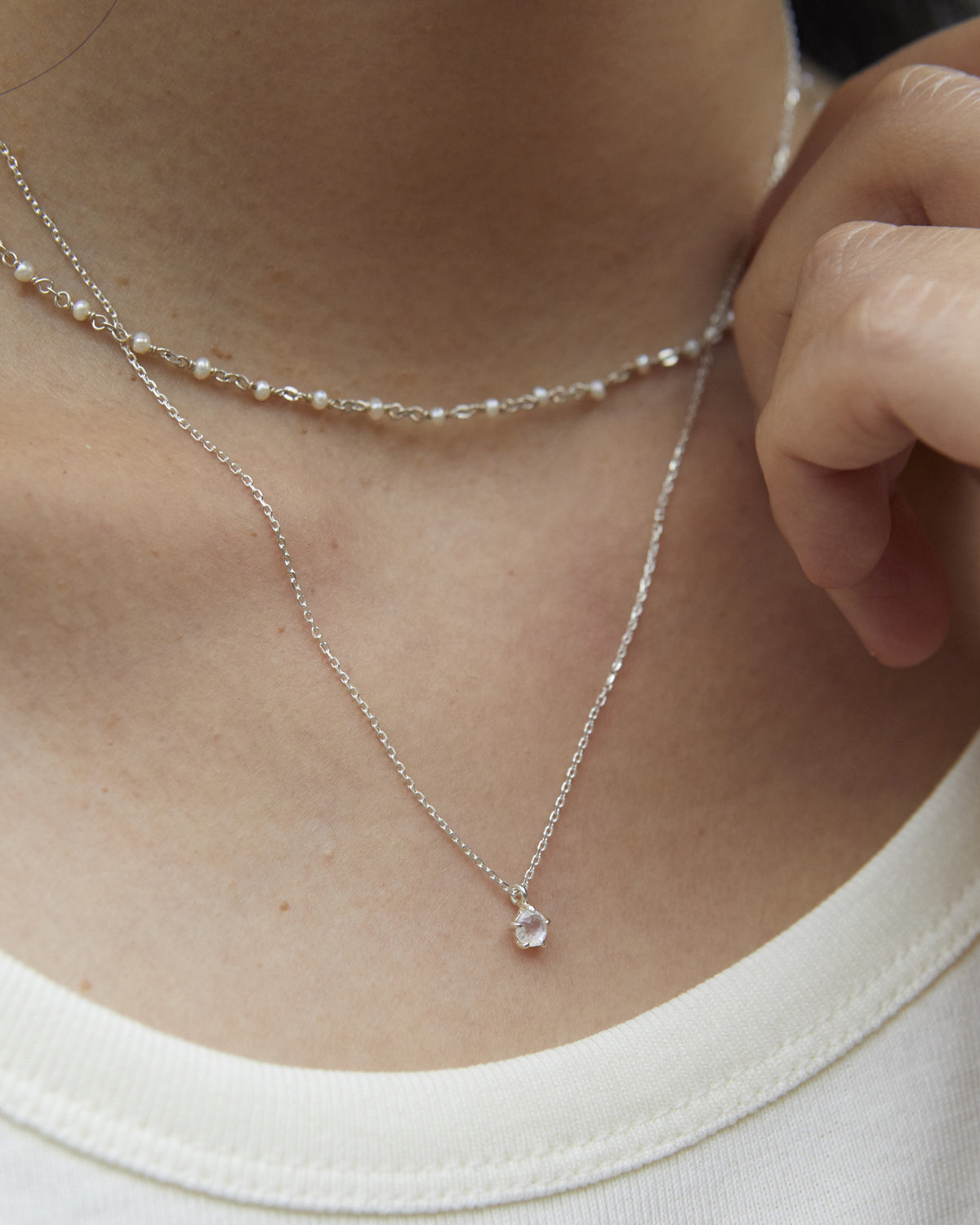moonstone aperture necklace – its glow shifts quietly as the light moves | HANNA543
