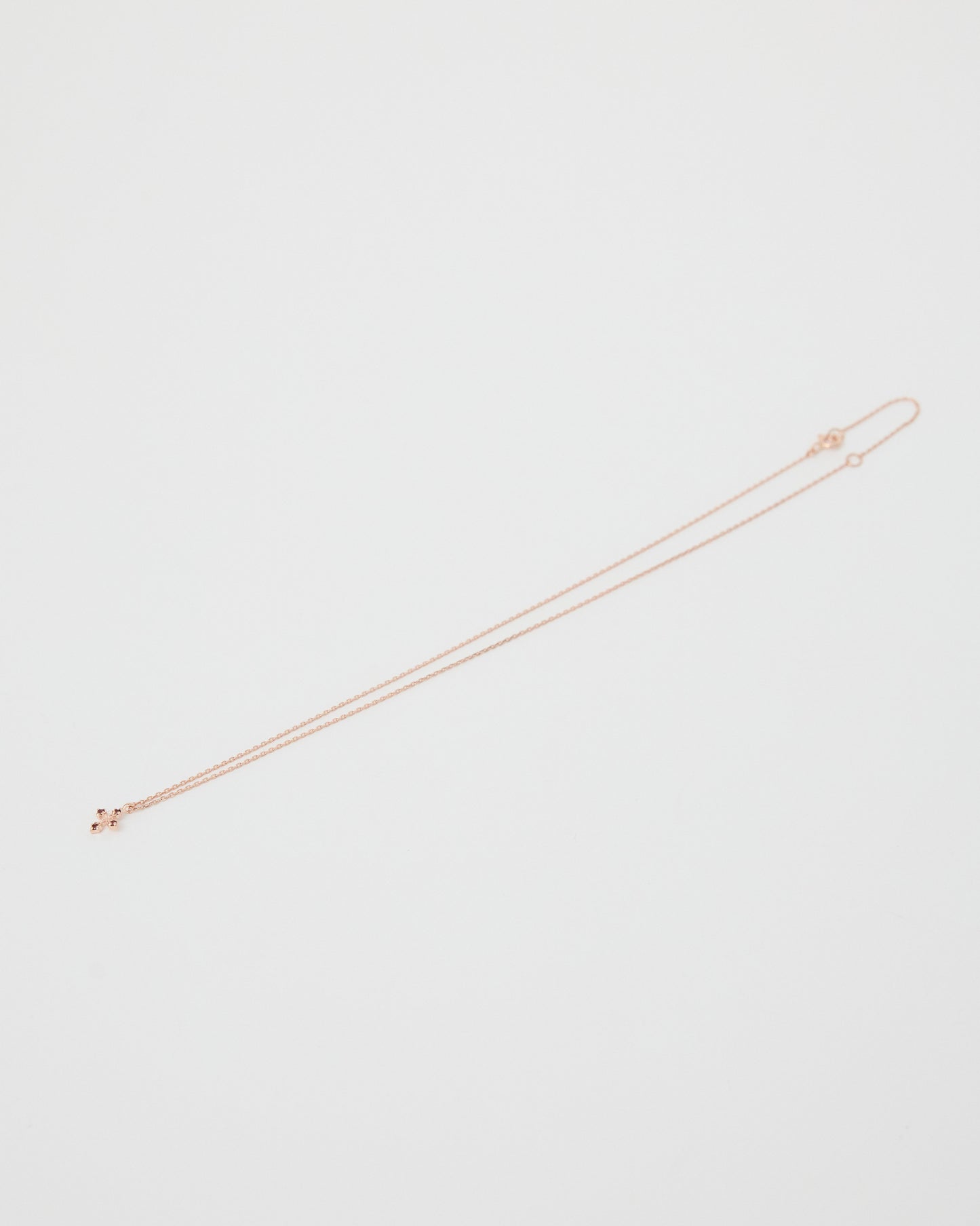 rose gold necklace on a white background