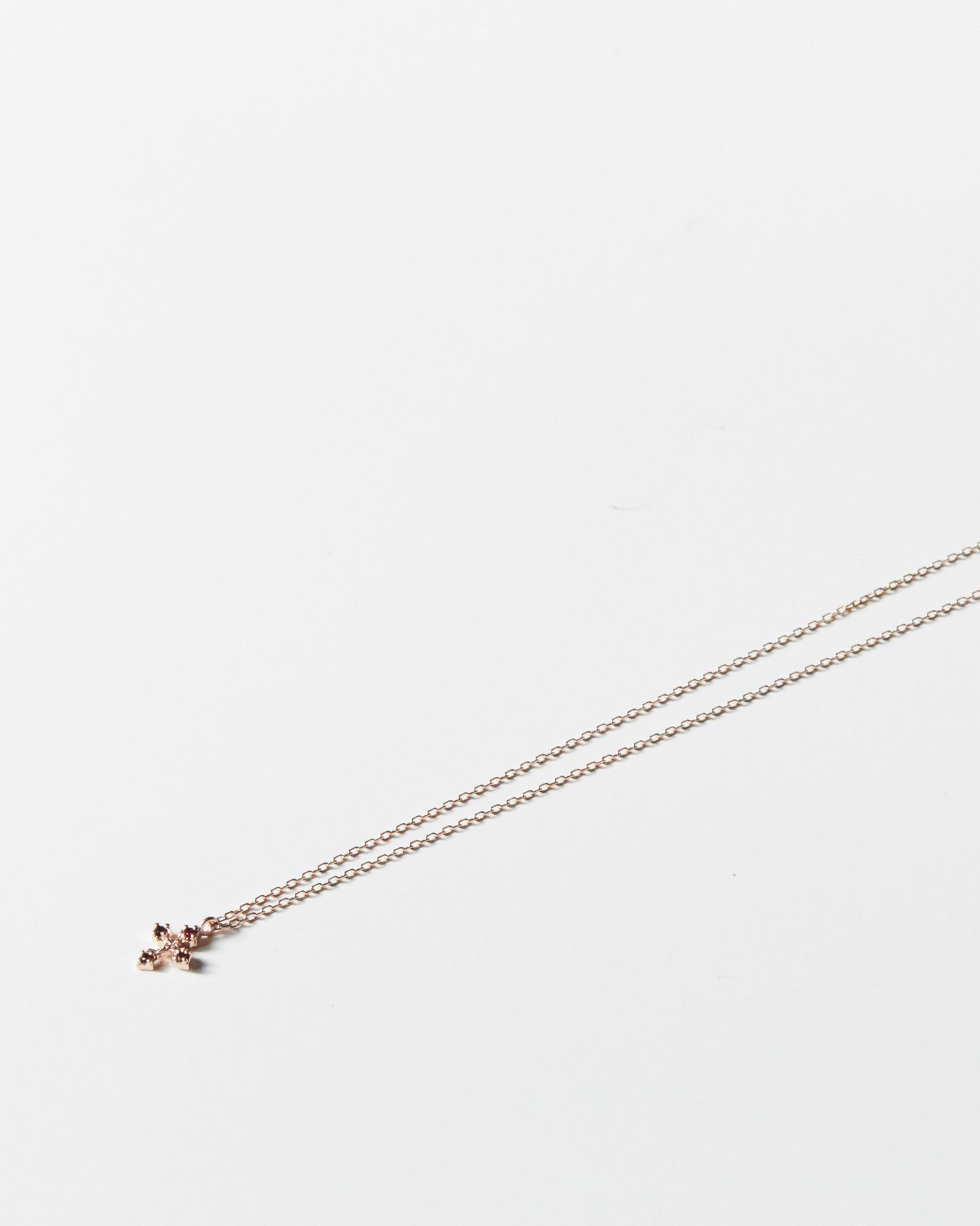 N334 - rosy bloom cross *in stock