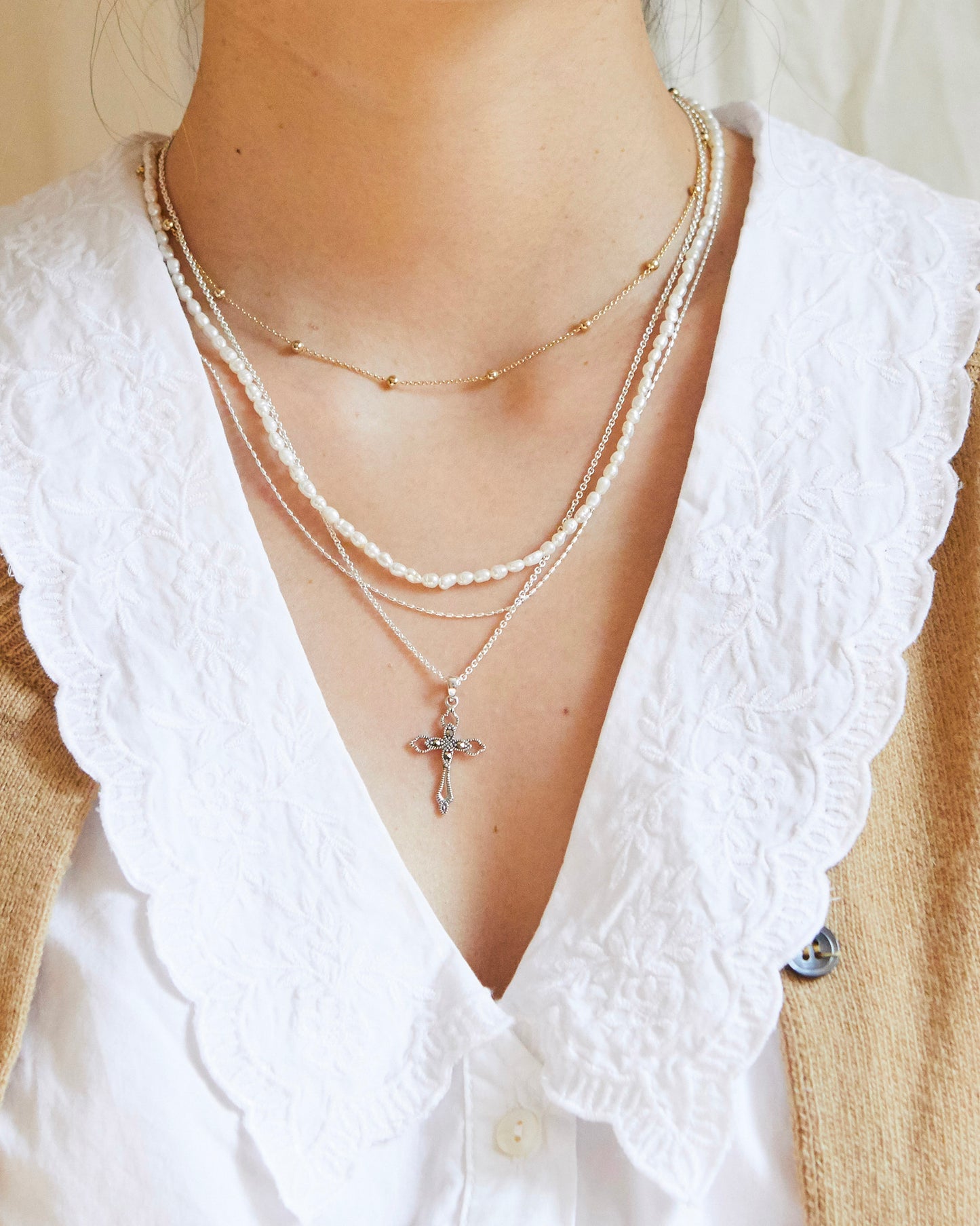 layered quietly but holding the whole stack together like the most reliable piece in your jewelry rotation