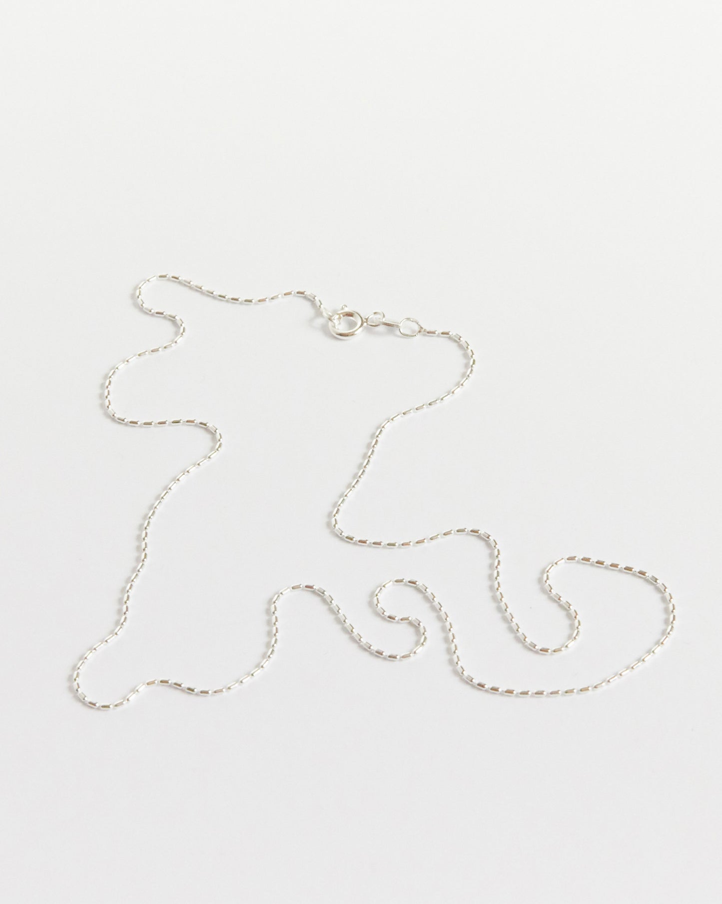 the kind of detailed silver chain that makes people look twice (and then ask where it’s from)