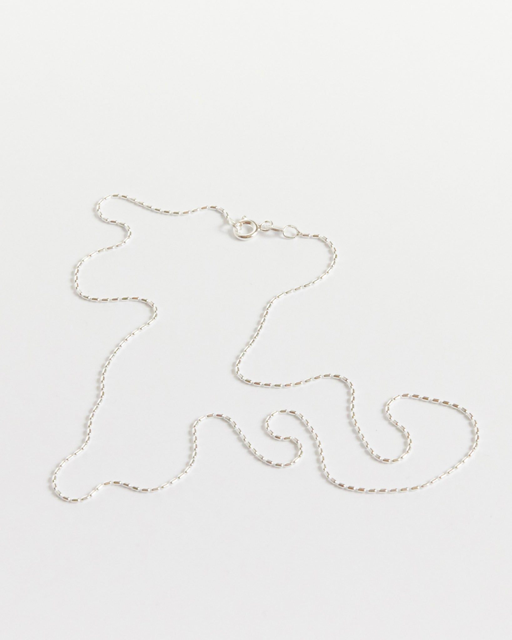 the kind of detailed silver chain that makes people look twice (and then ask where it’s from)