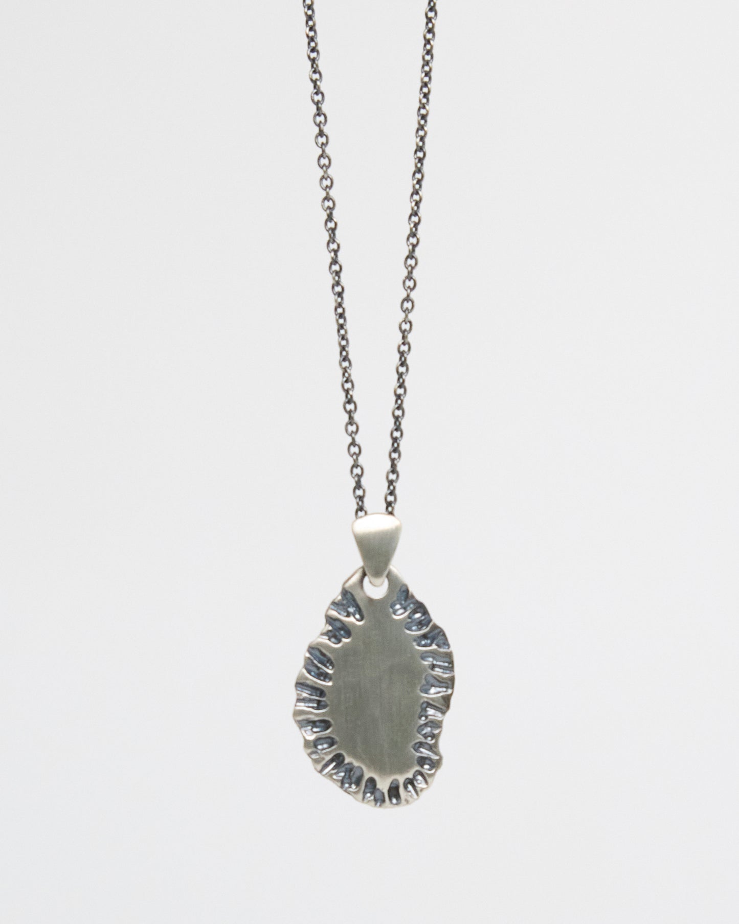 N502 - etched tide pendant