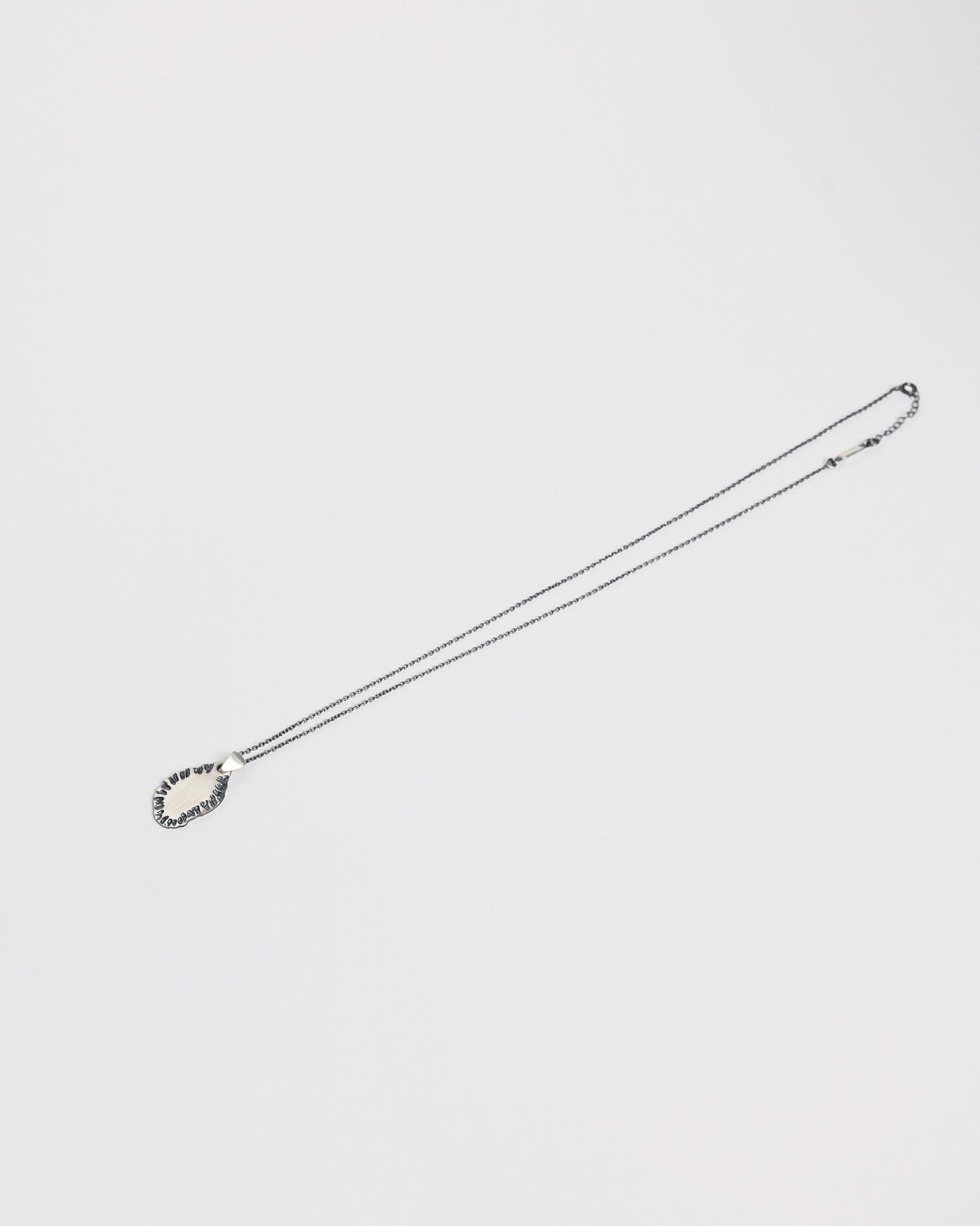 N502 - etched tide pendant