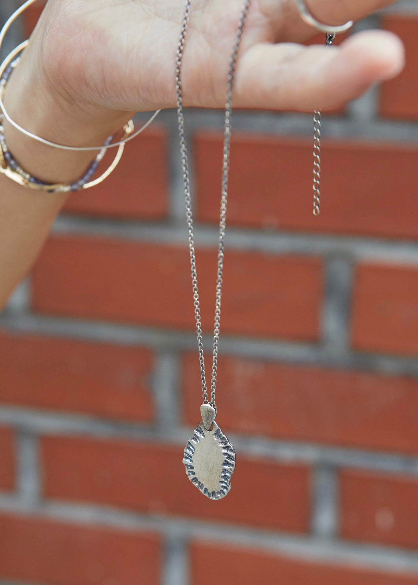 N502 - etched tide pendant