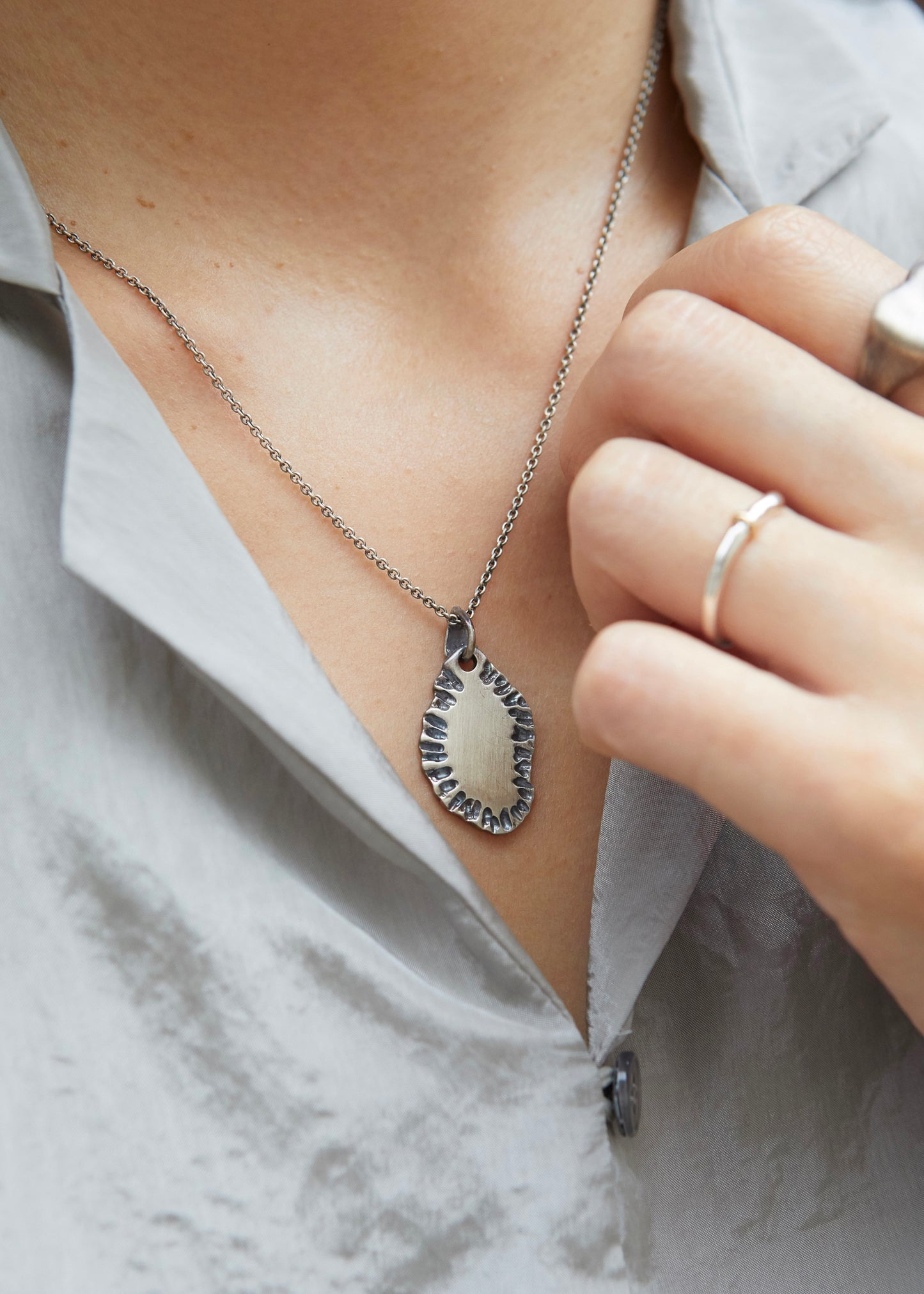 N502 - etched tide pendant