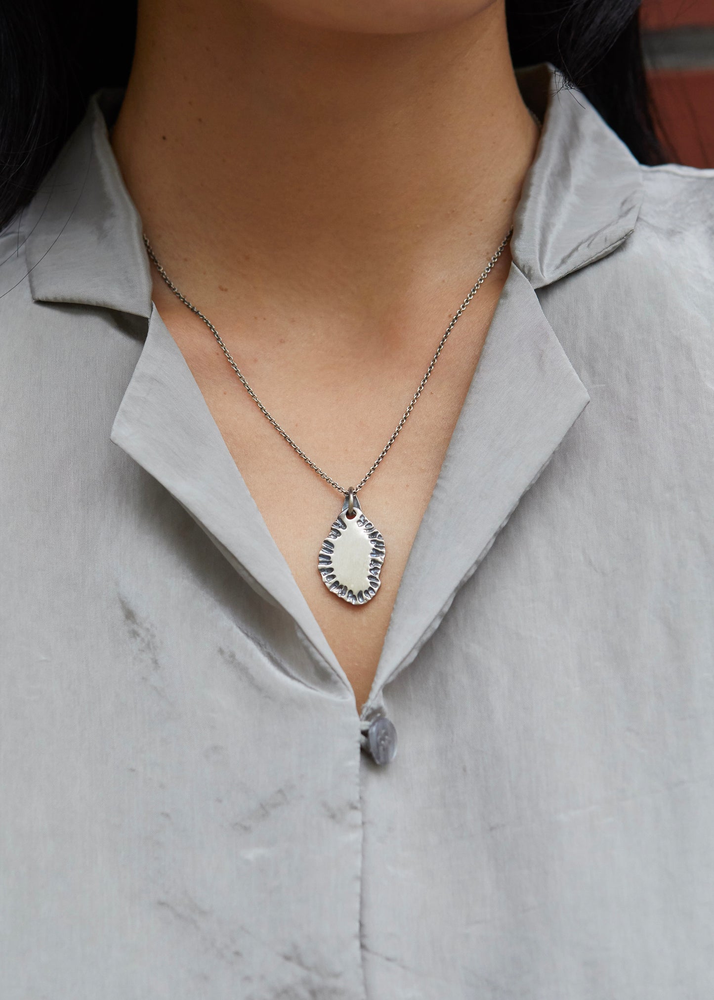 N502 - etched tide pendant