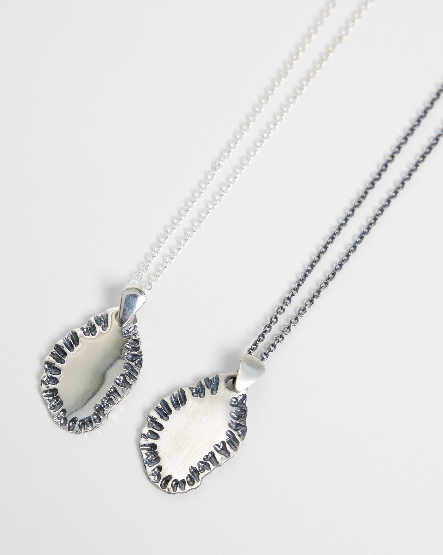 N502 - etched tide pendant