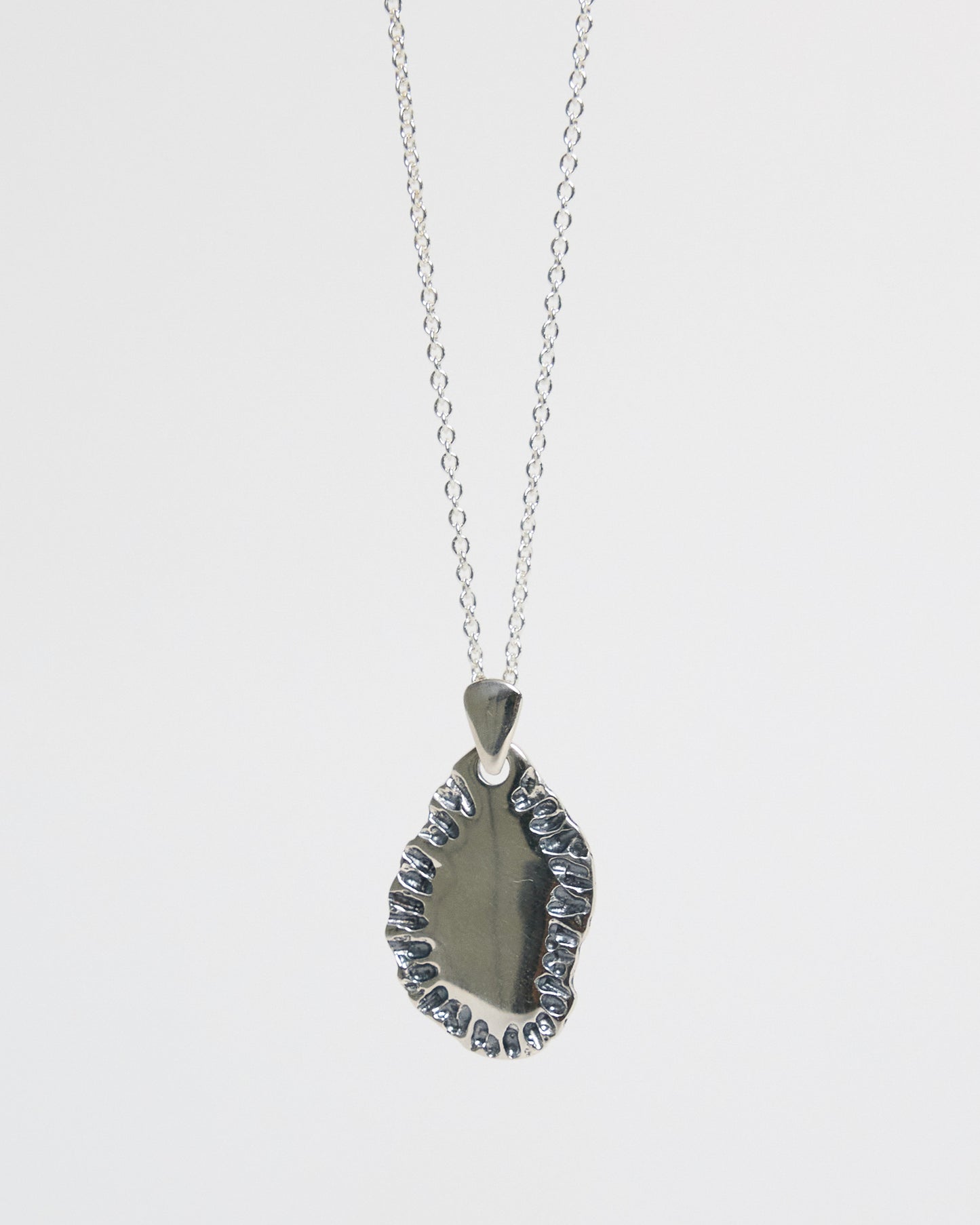 N502 - etched tide pendant