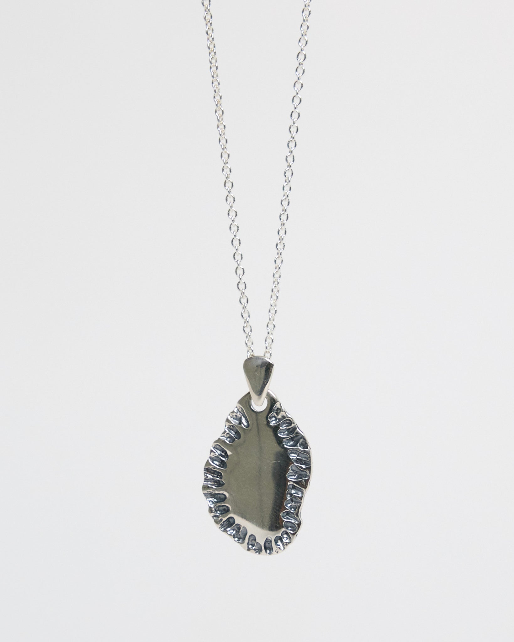 N502 - etched tide pendant