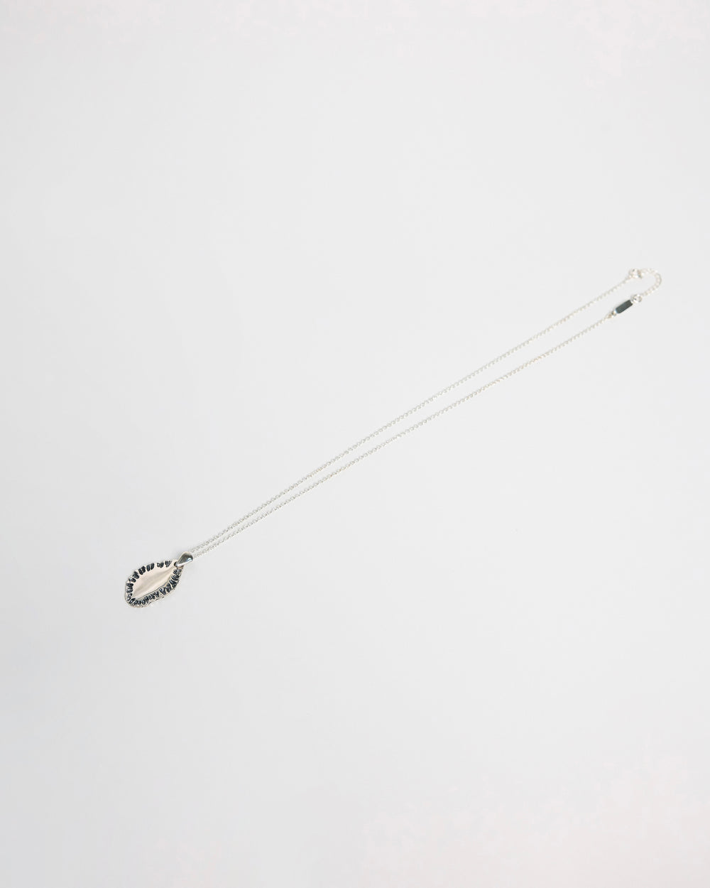 N502 - etched tide pendant