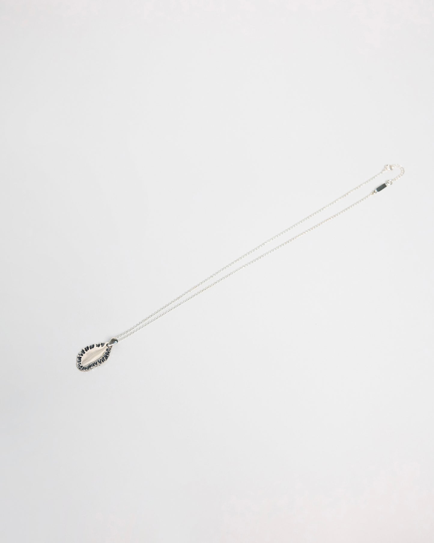 N502 - etched tide pendant