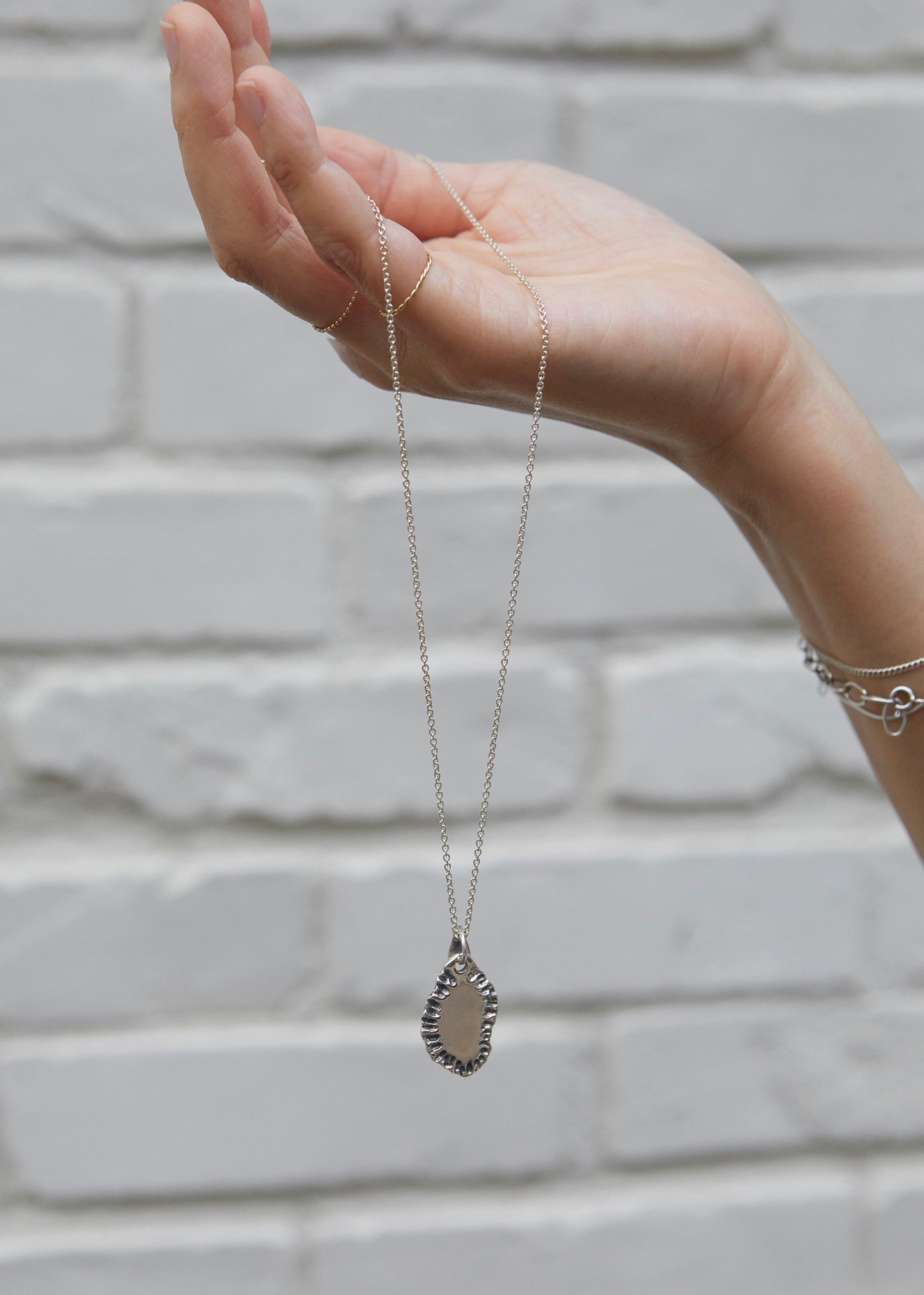 N502 - etched tide pendant