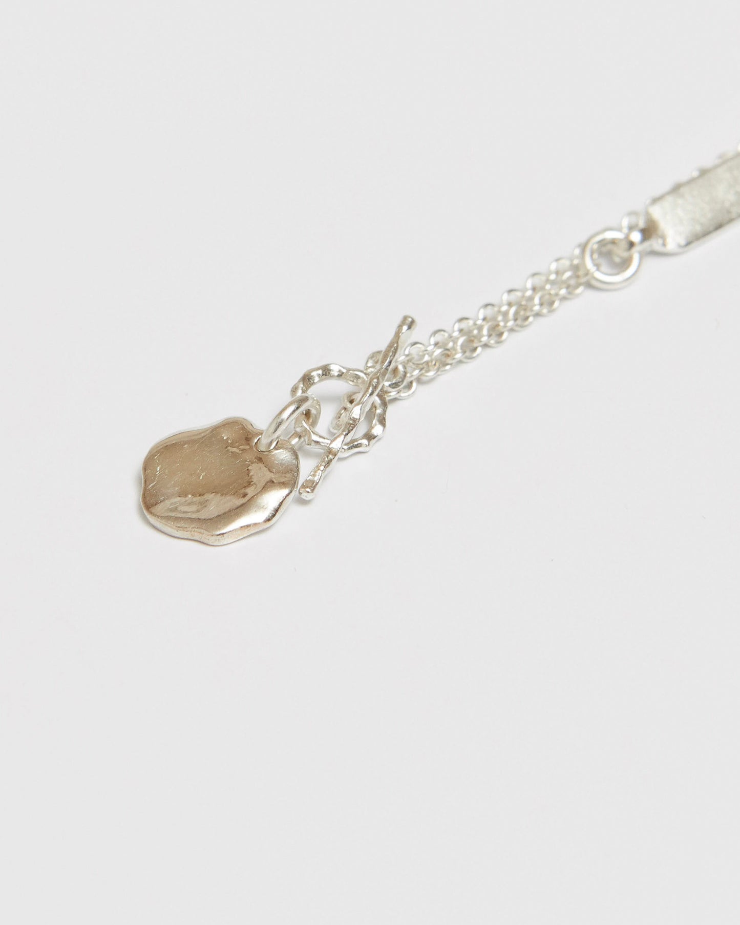Back and clasp detail of silver necklace with adjustable chain