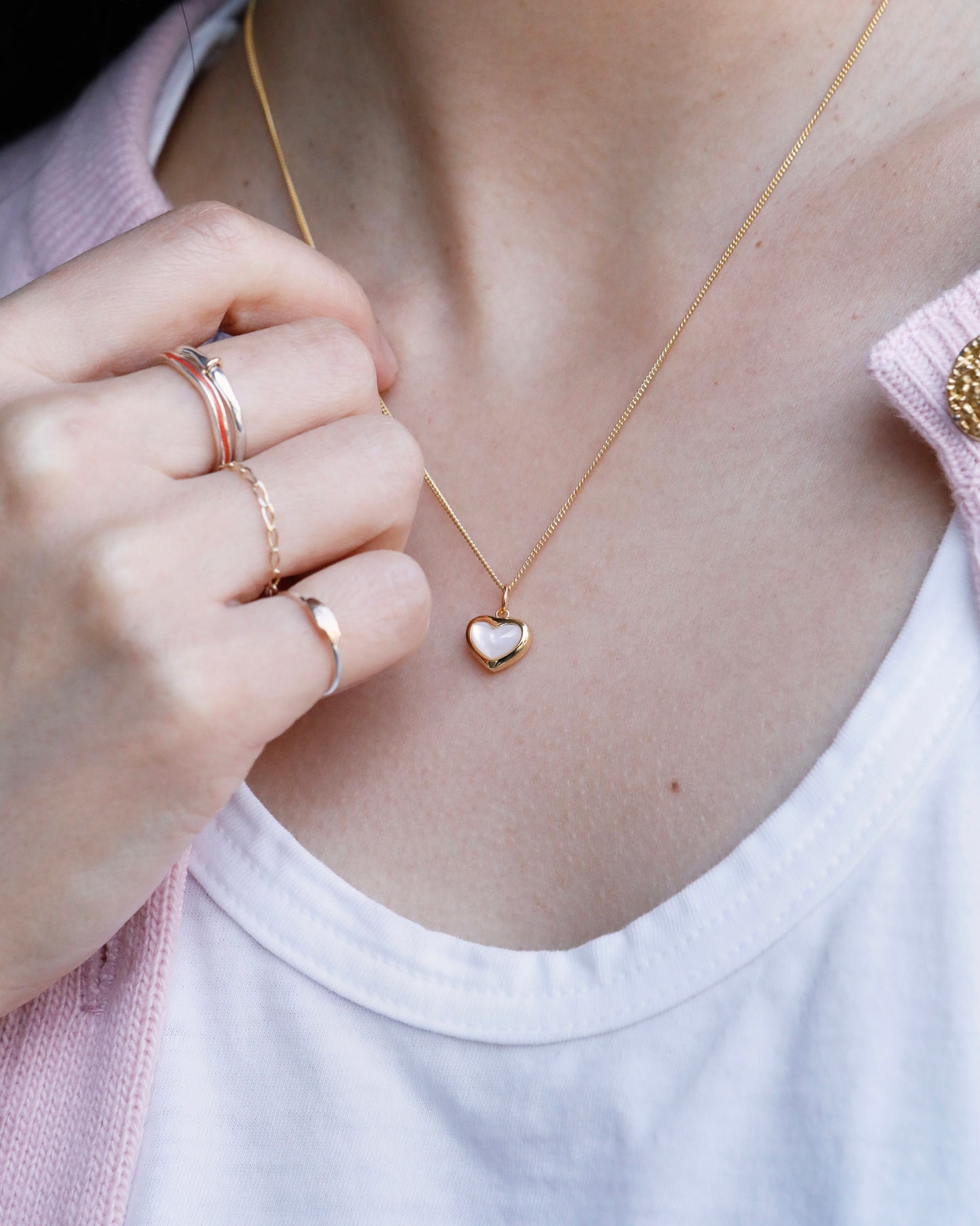 delicate gold heart pendant necklace with natural pearl luster
