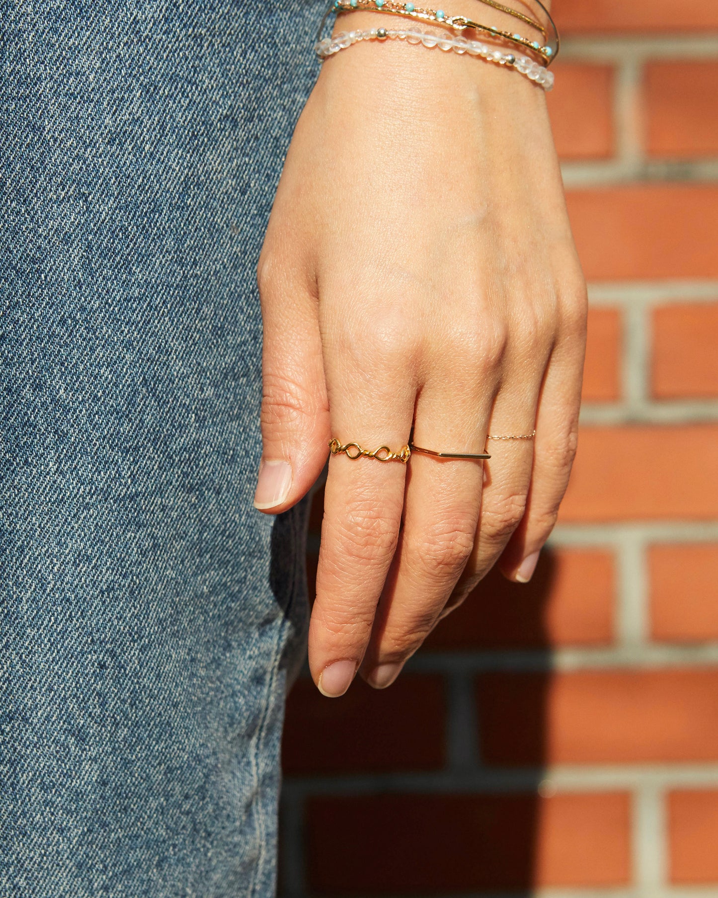 delicate gold loop ring worn close to skin, lightweight and comfortable fit