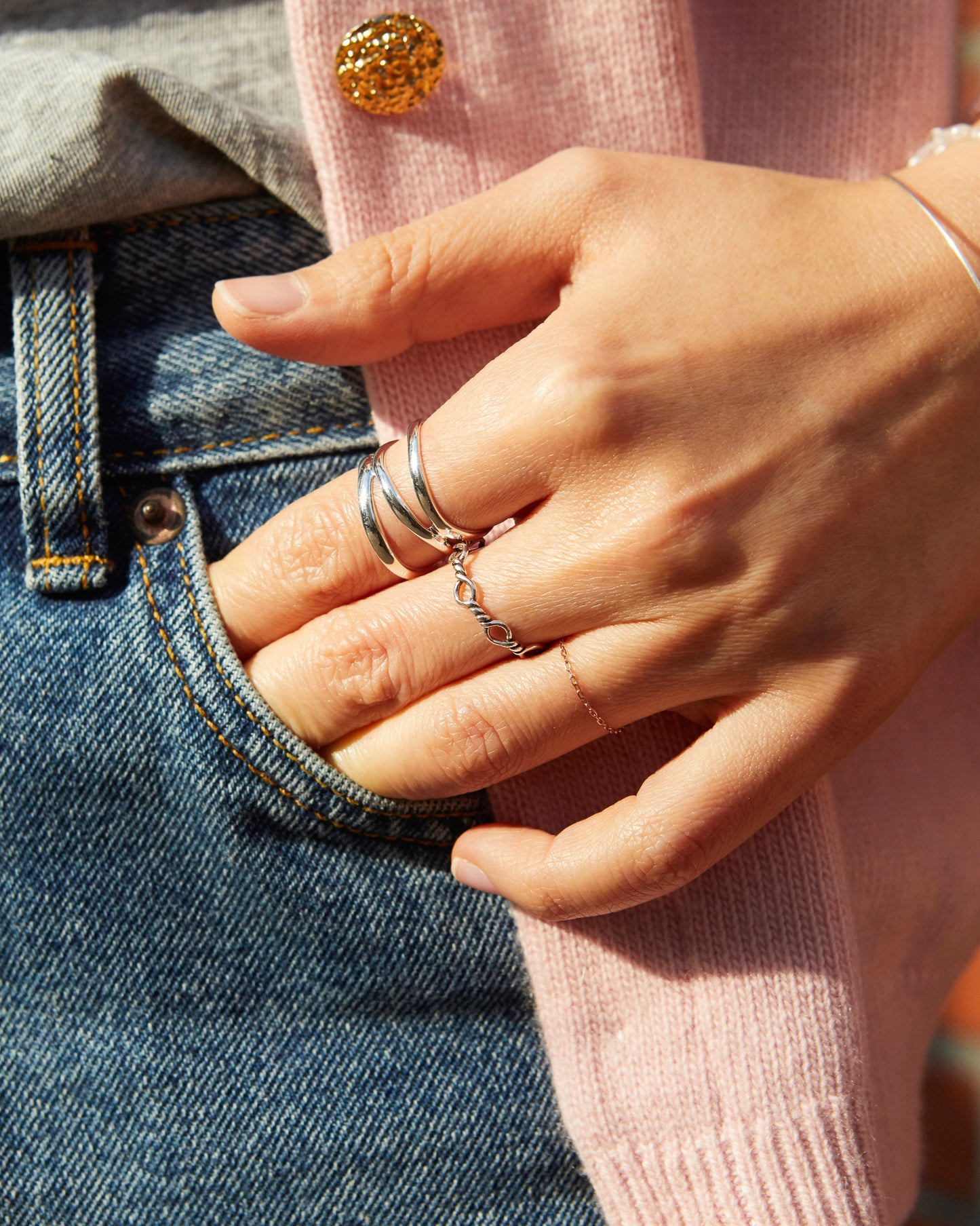 delicate silver loop ring worn close to skin, lightweight and comfortable fit