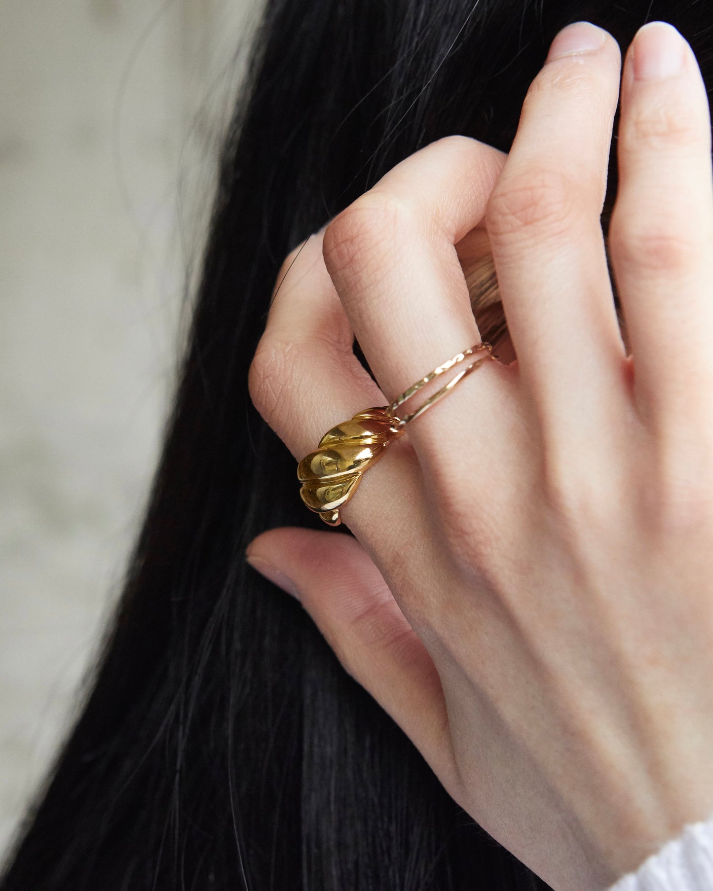 chunky twisted ring worn on finger, smooth edges and comfortable fit