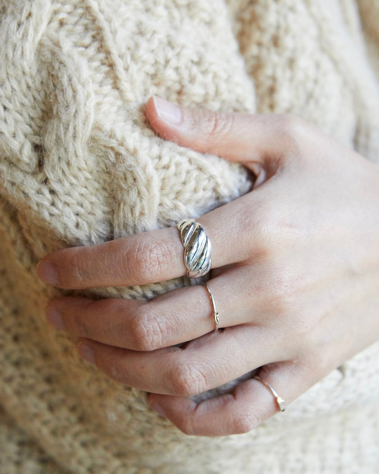 polished twisted ring highlighting smooth metal surface and sculpted volume