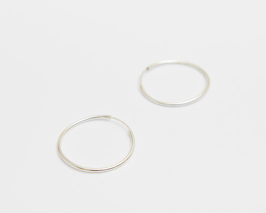 spring loop hoop earring – open hoop held by gentle spring tension | HANNA543