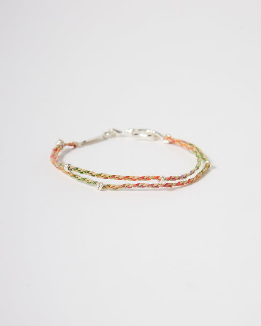 Handwoven multicolor cord bracelet with sterling silver accents, minimalist rainbow bracelet