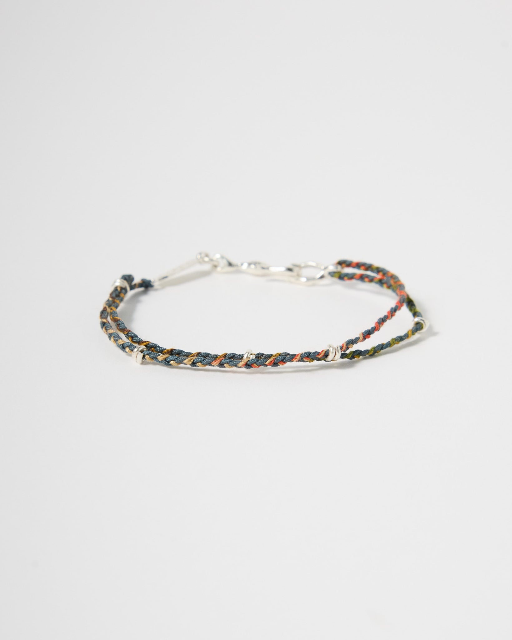 Handwoven earth-tone cord bracelet with sterling silver accents and clasp, minimalist everyday jewelry