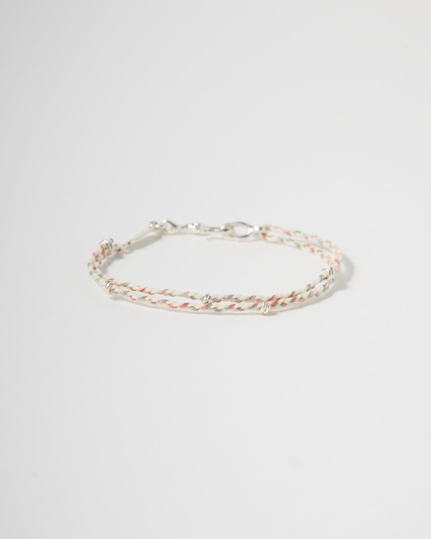 Handwoven pastel cord bracelet with sterling silver clasp and accents, minimalist everyday jewelry