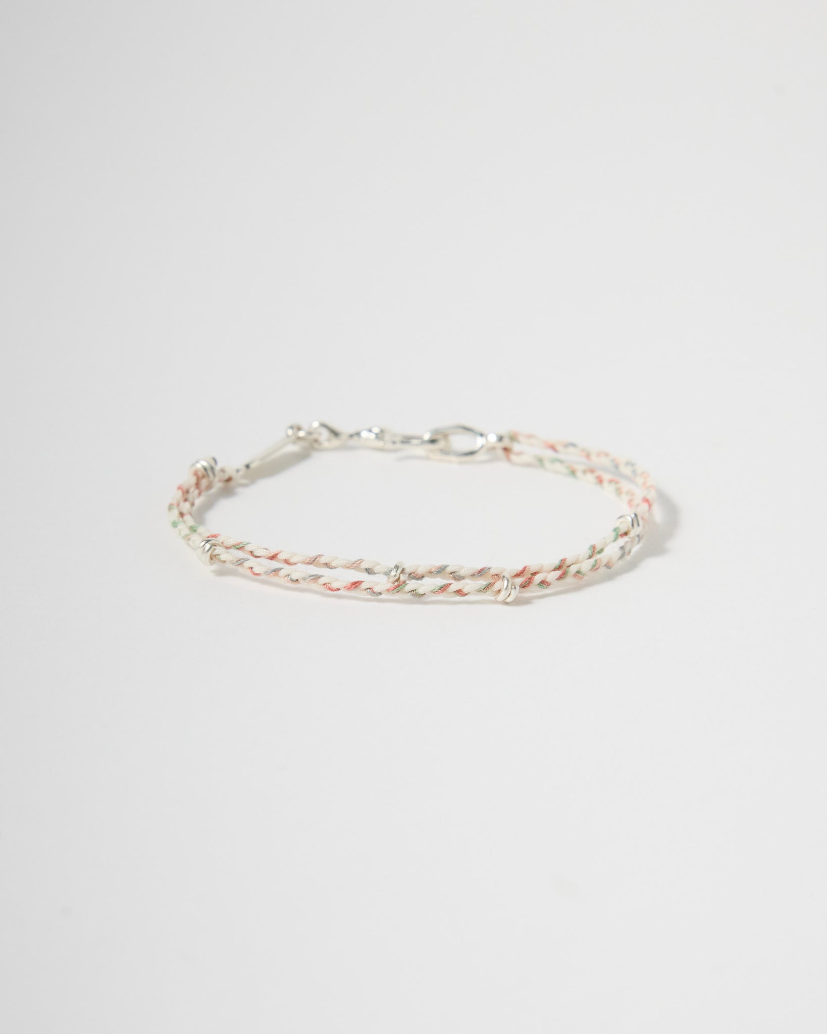 Handwoven pastel cord bracelet with sterling silver clasp and accents, minimalist everyday jewelry