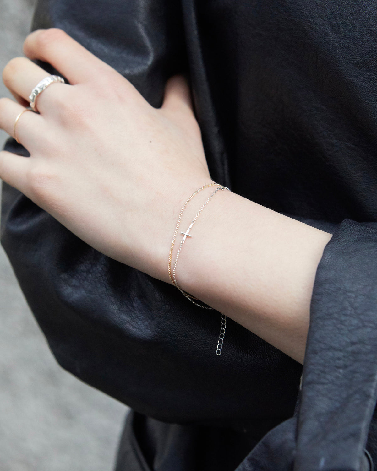 cross axis chain bracelet in silver – worn on the wrist with a black leather jacket | HANNA543