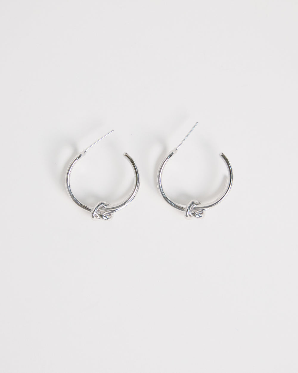 silver knot hoop earrings minimal double hoop design modern clean jewelry everyday silver earrings