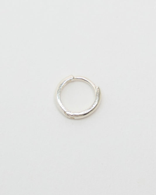 Tiny 5mm sterling silver huggie hoop earring with a softly textured band, front view – HANNA543 E155 soft halo huggie