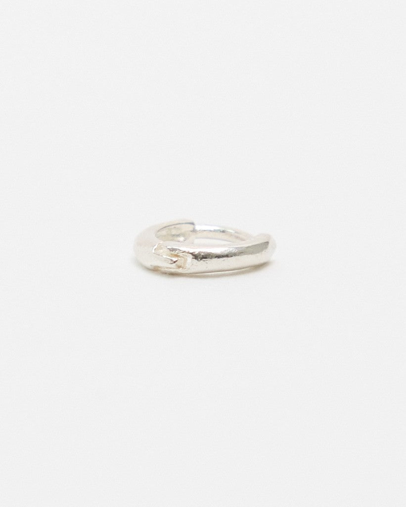 Side view of a tiny sterling silver huggie hoop earring – HANNA543 E155 soft halo huggie