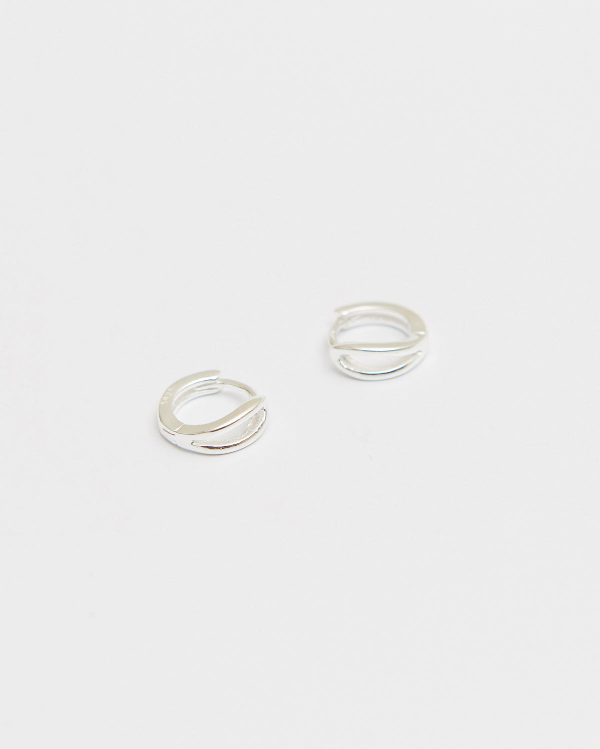 E908 spark click huggie earring in 925 sterling silver by HANNA543