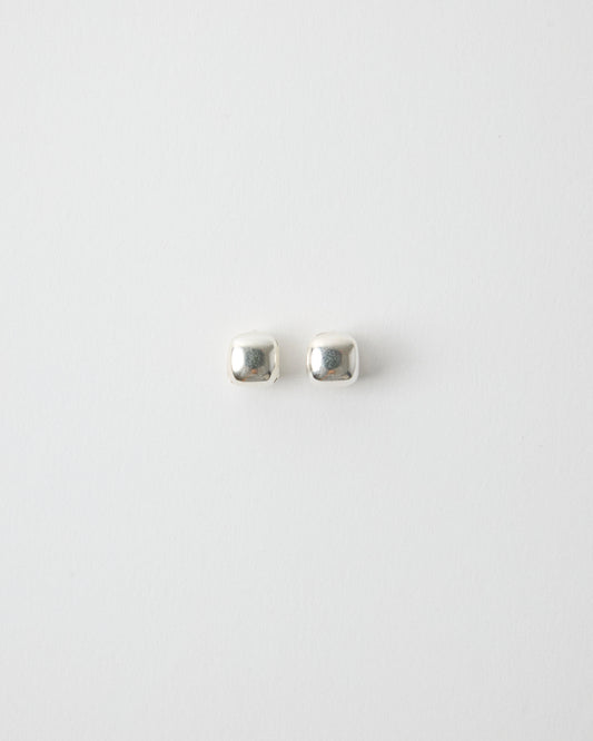 pair of sterling silver square stud earrings on white background, polished cube shape minimal jewelry, clean modern product shot