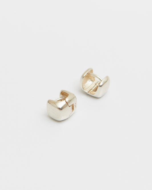 pair of sterling silver square stud earrings on white background, polished cube shape minimal jewelry, clean modern product shot