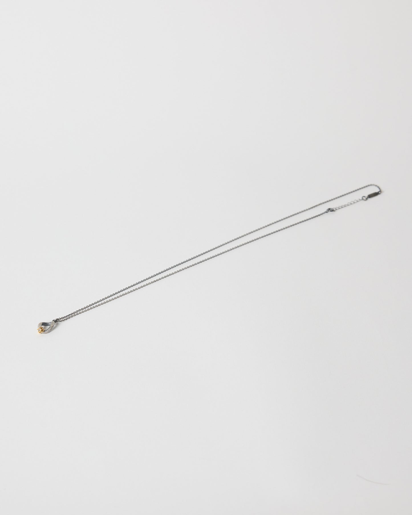 Metal rod with a spherical end on a white background
